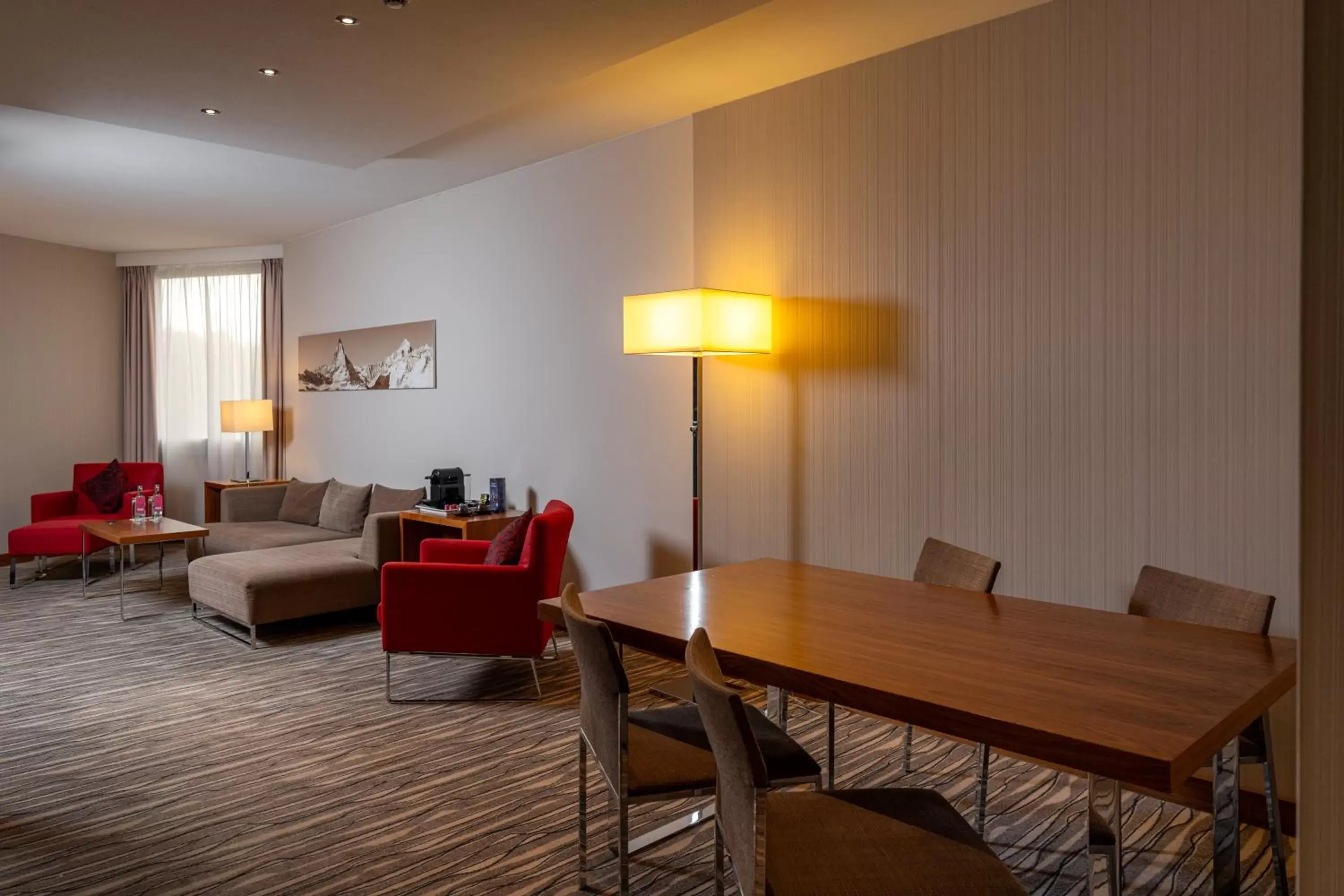 Living room, Dining Area in Moevenpick Hotel And Casino Geneva