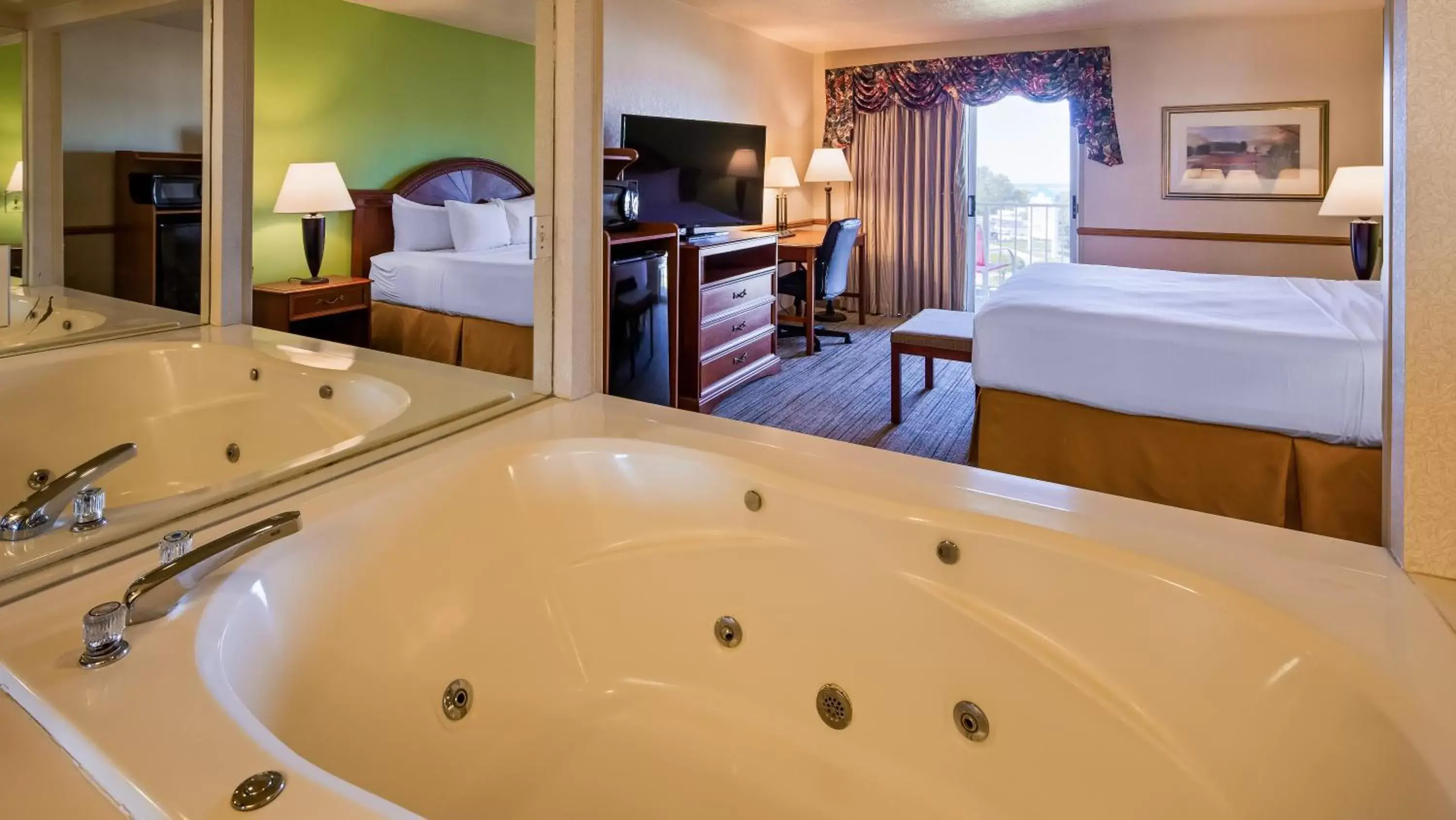 Hot Tub, Bed in Apple Tree Inn; SureStay Collection by Best Western Hot Tub, Bed in Apple Tree Inn; SureStay Collection by Best Western