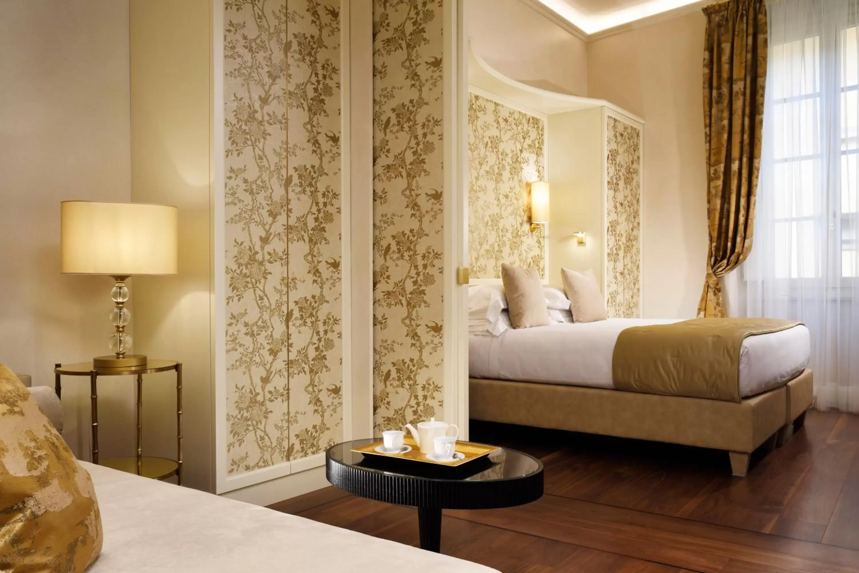 Seating area, Bed in San Firenze Suites & Spa
