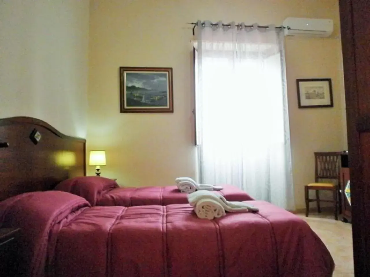 Bed in I Cappuccini Rooms