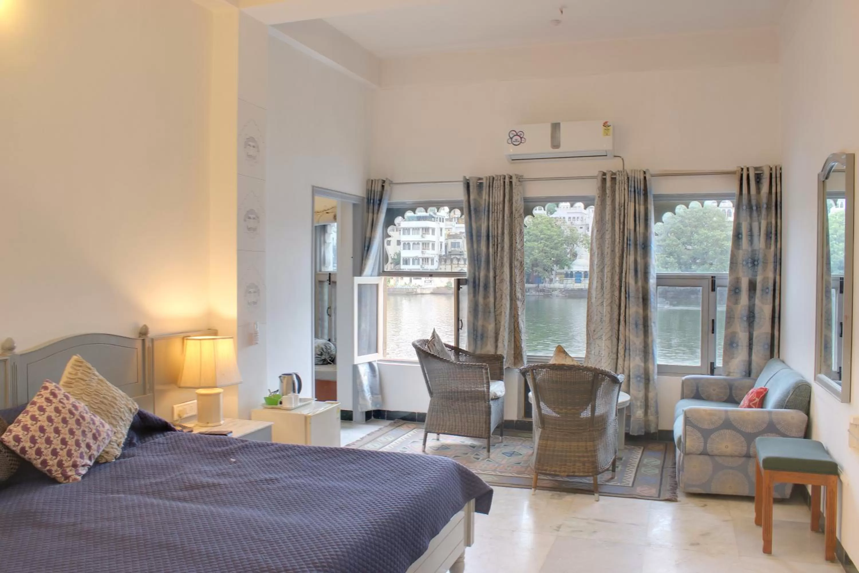 Seating area, Bed in Sarovar - Lake Facing Boutique Hotel On Lake Pichola