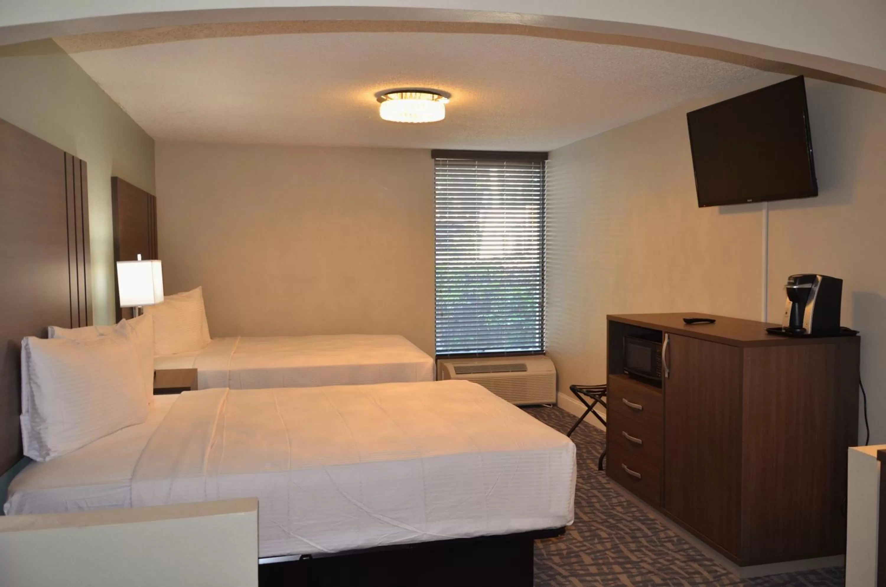 Bed in Opal Hotel & Suites