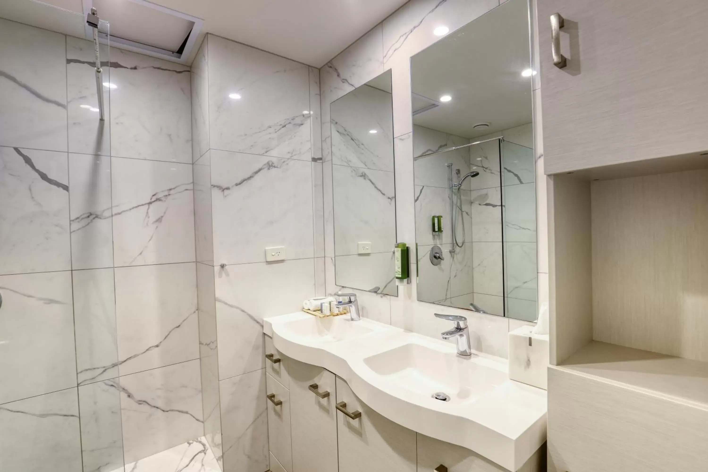 Bathroom in Ramada Suites by Wyndham Nautilus Orewa