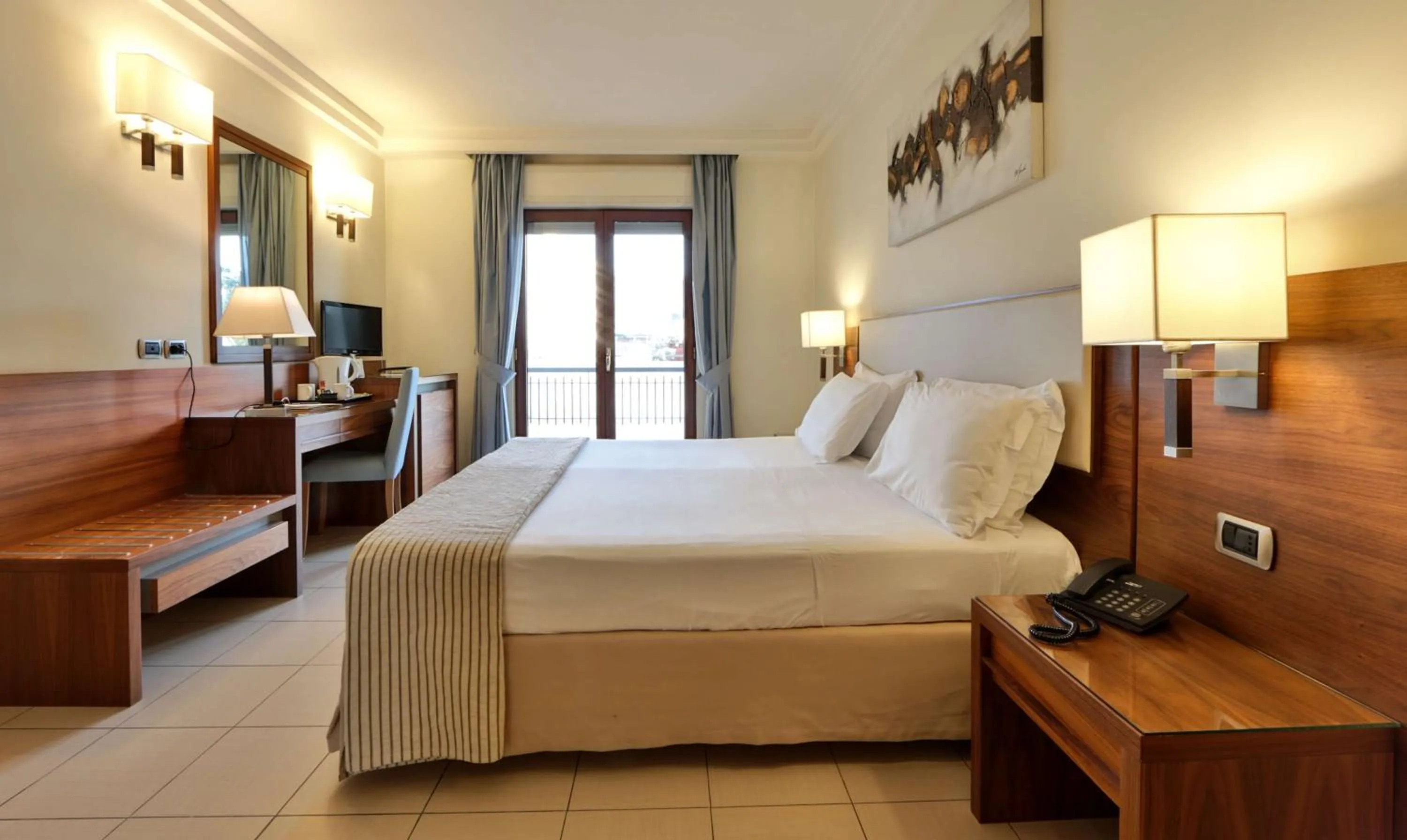 Bed in Suites & Residence Hotel