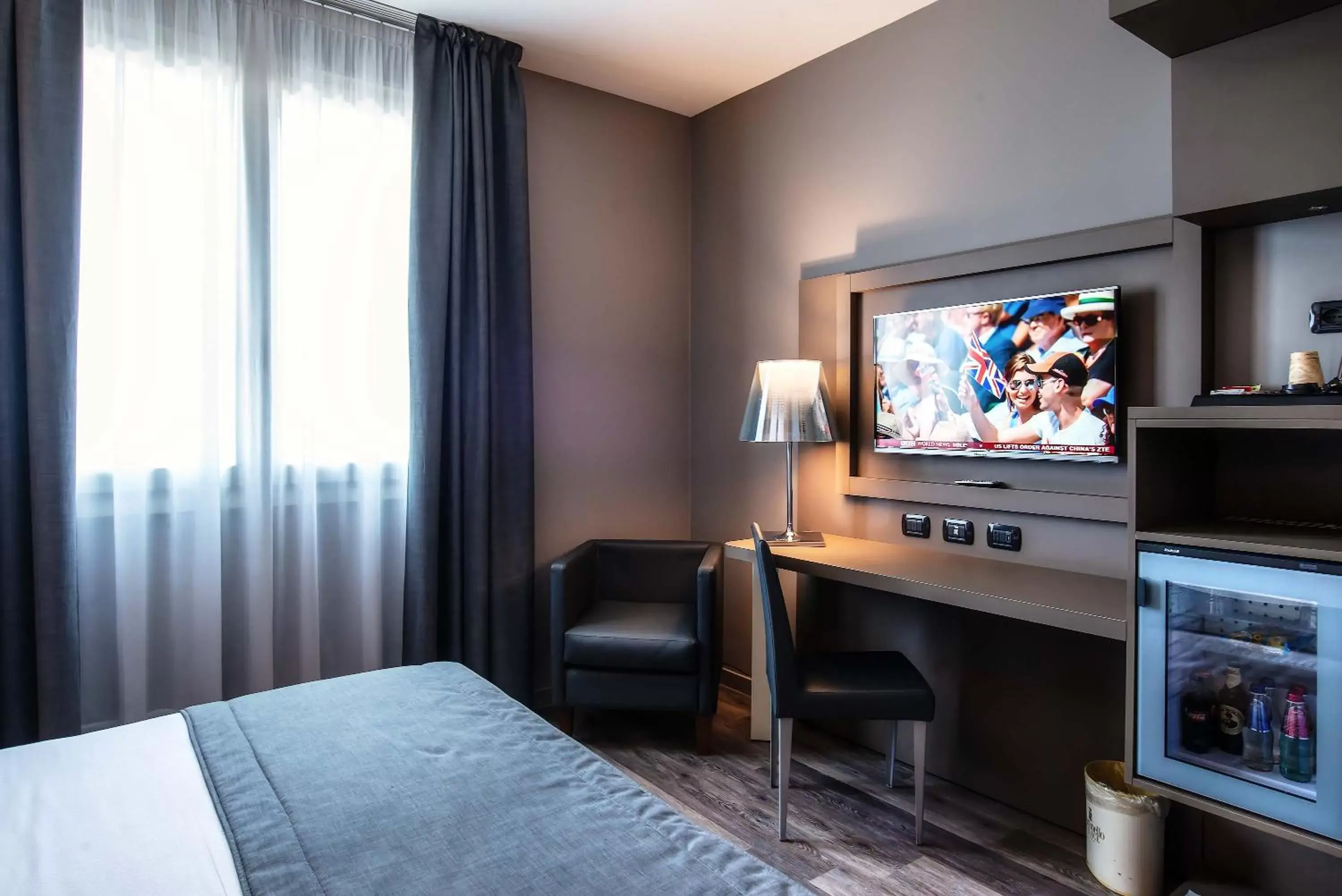 Bed, TV/Entertainment Center in Maranello Palace