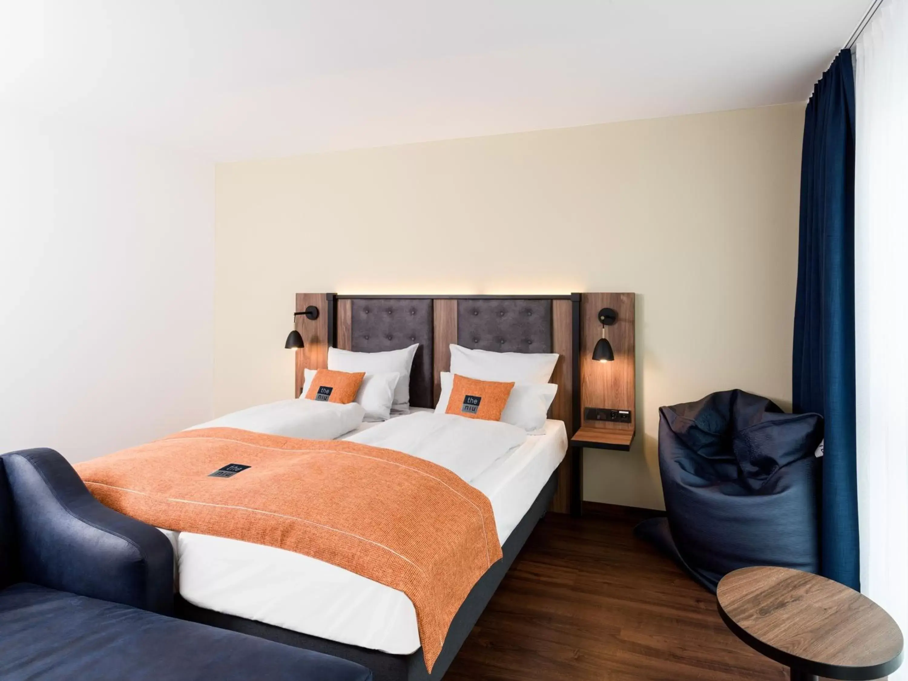 Seating area, Bed in Holiday Inn - the niu, Saddle Fürth by IHG Seating area, Bed in Holiday Inn - the niu, Saddle Fürth by IHG