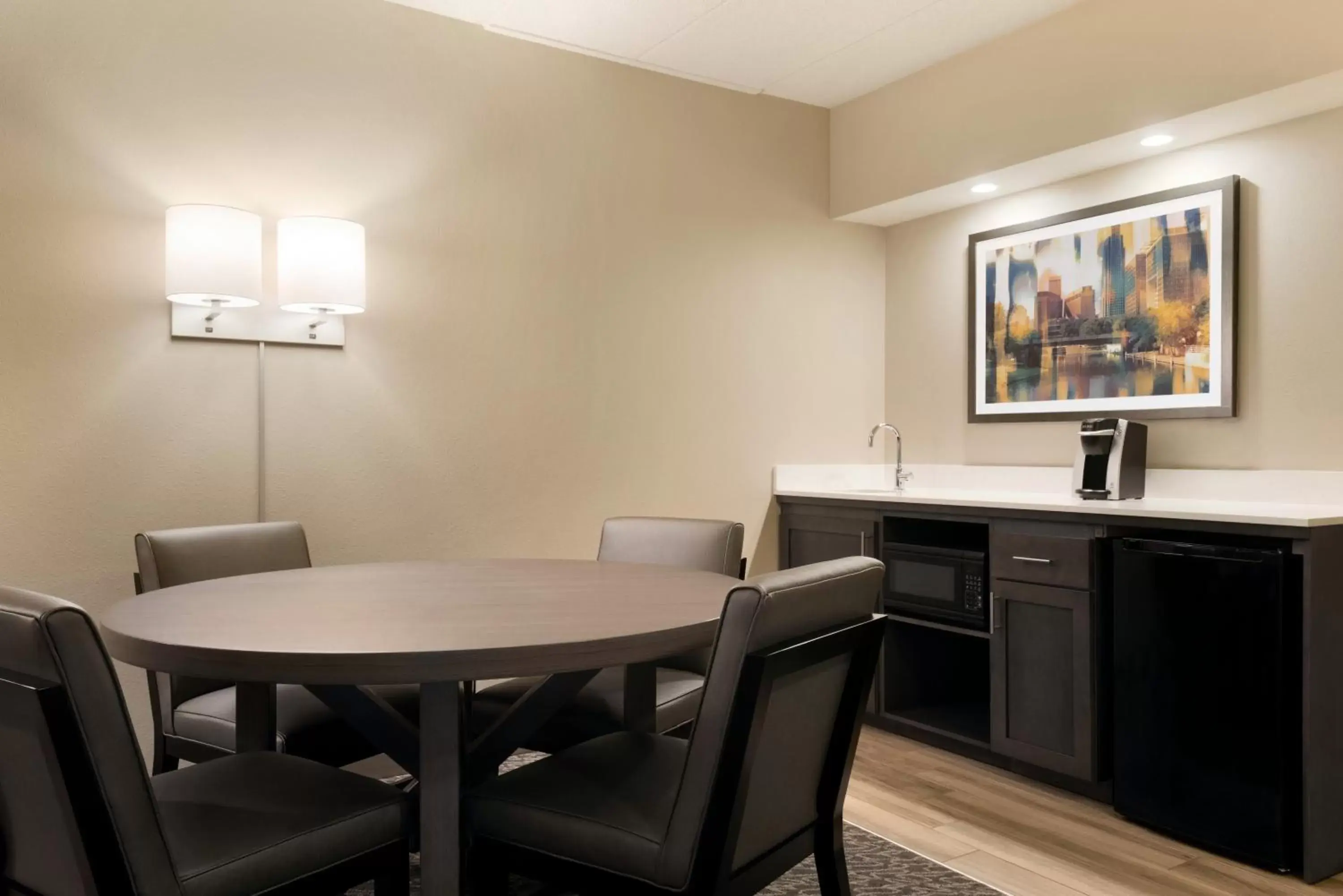 Bedroom, Dining Area in Holiday Inn Hotel & Suites Council Bluffs, an IHG Hotel