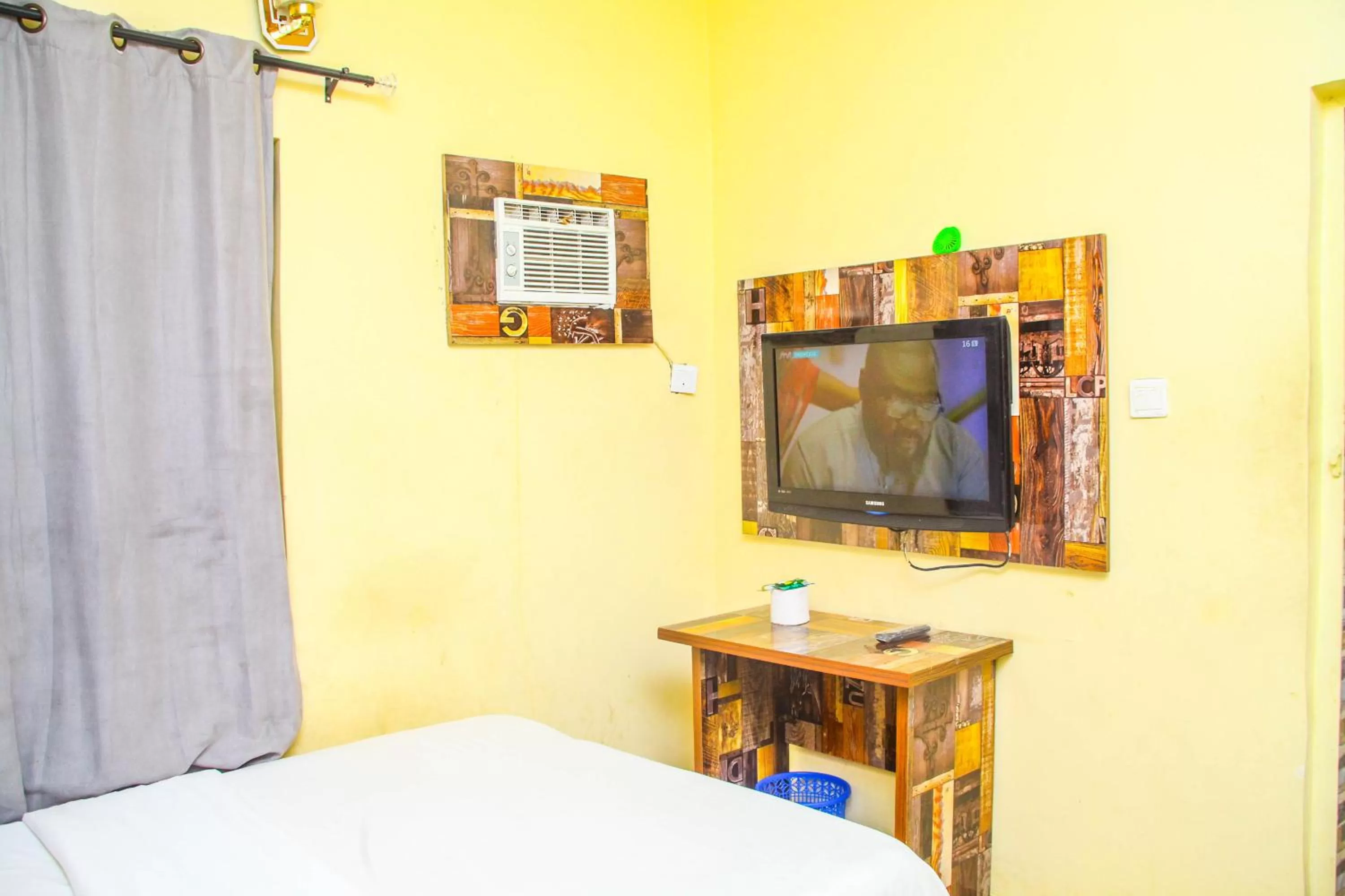 Bedroom, TV/Entertainment Center in ONTARIO SUITES