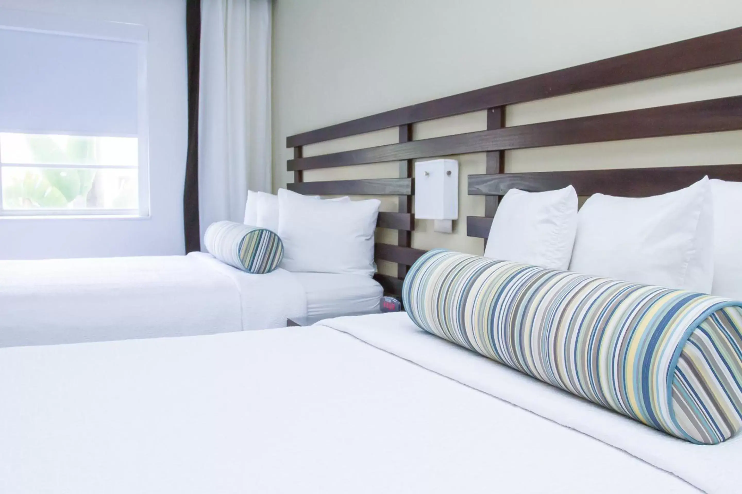 Bed in Dorchester Hotel & Suites