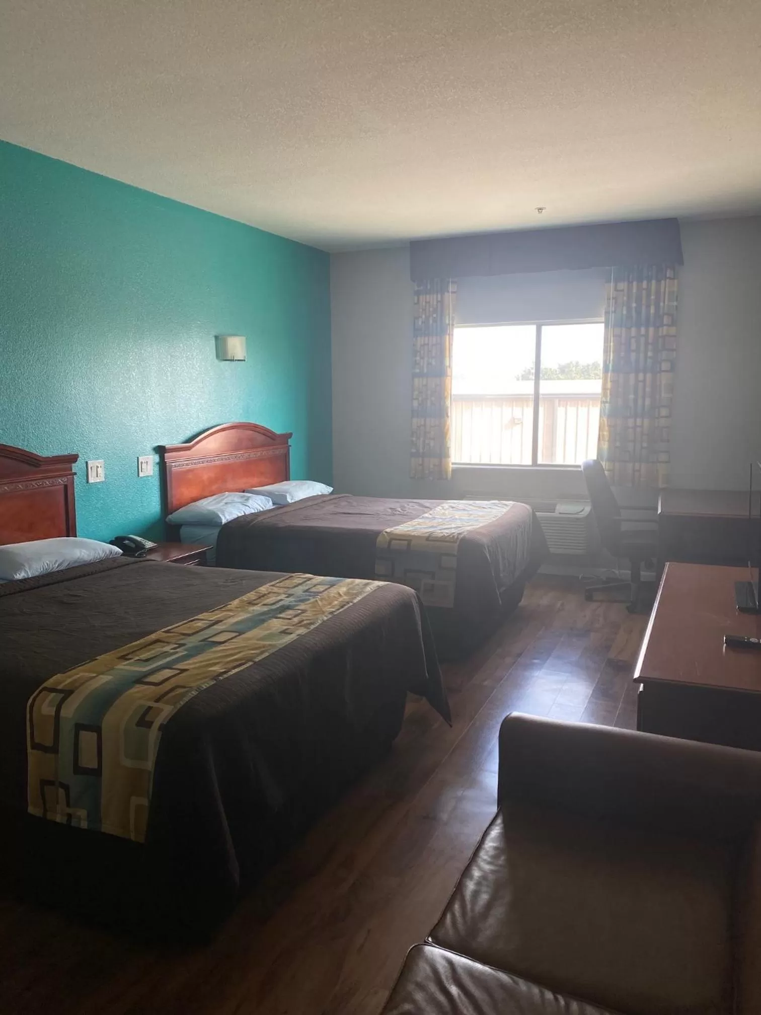 Bed in Tropicana Inn and Suites