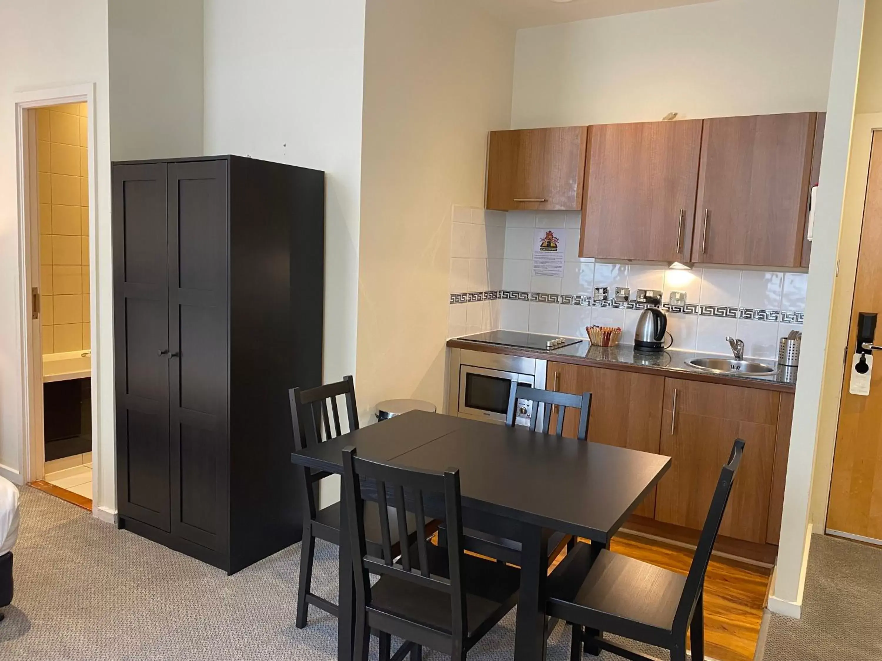 Kitchen or kitchenette, Dining Area in Grand Plaza Serviced Apartments