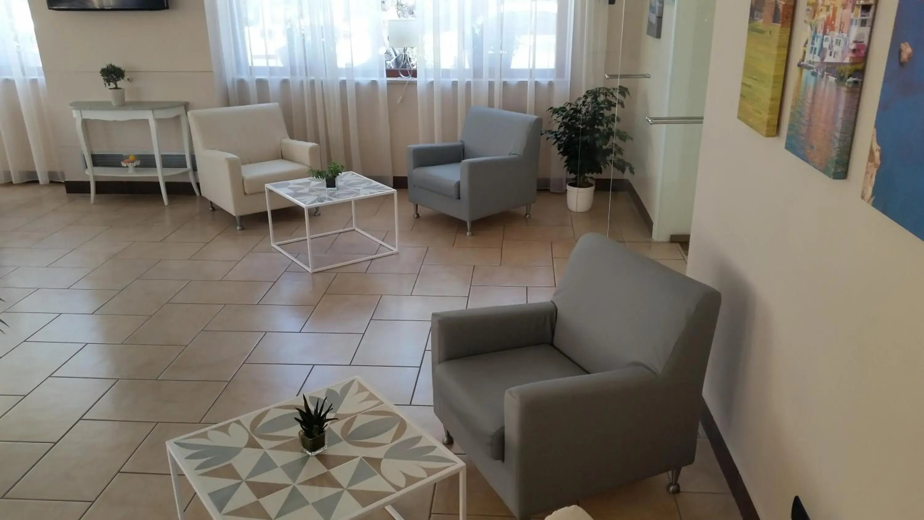 Communal lounge/ TV room, Seating Area in Hotel Leone