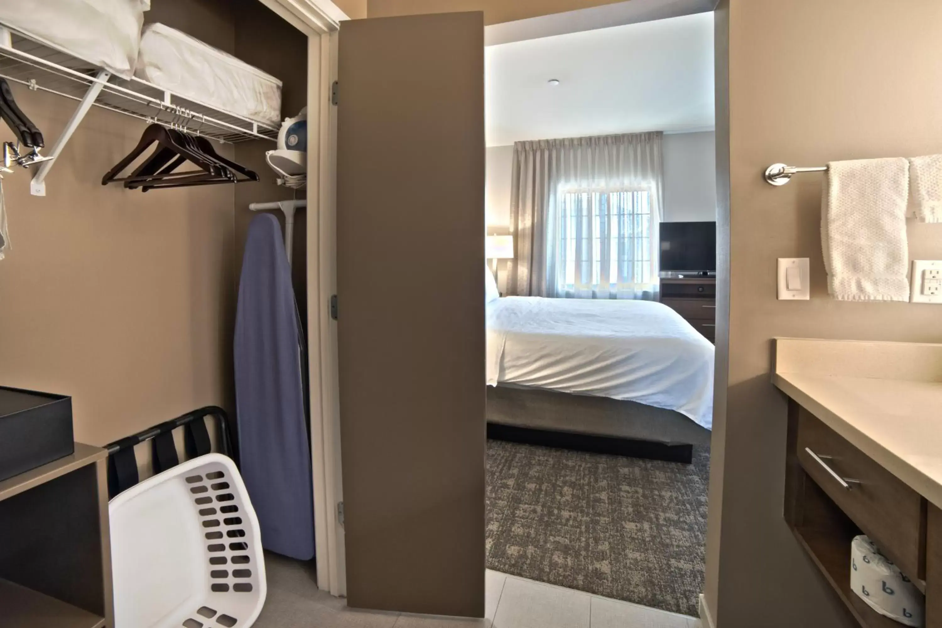 wardrobe, Bed in Staybridge Suites Houston - Humble Beltway 8 E, an IHG Hotel