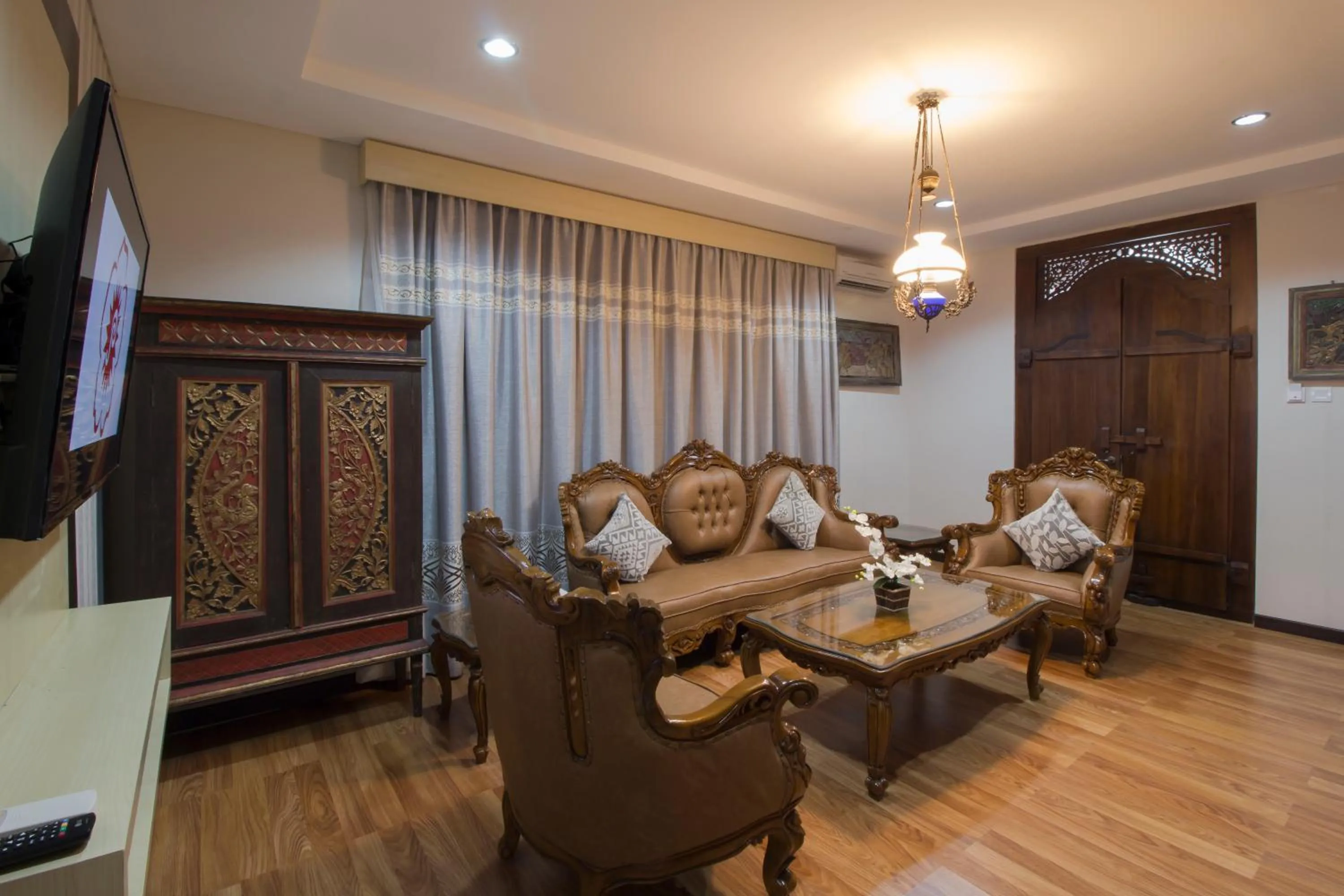 Living room in Grand Puri Saron Hotel Yogyakarta