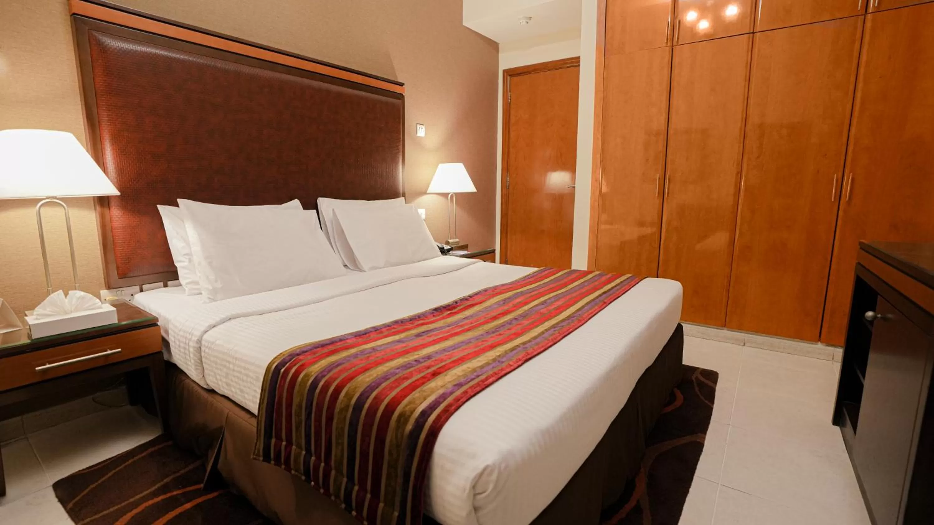 Bed in Xclusive Hotel Apartments