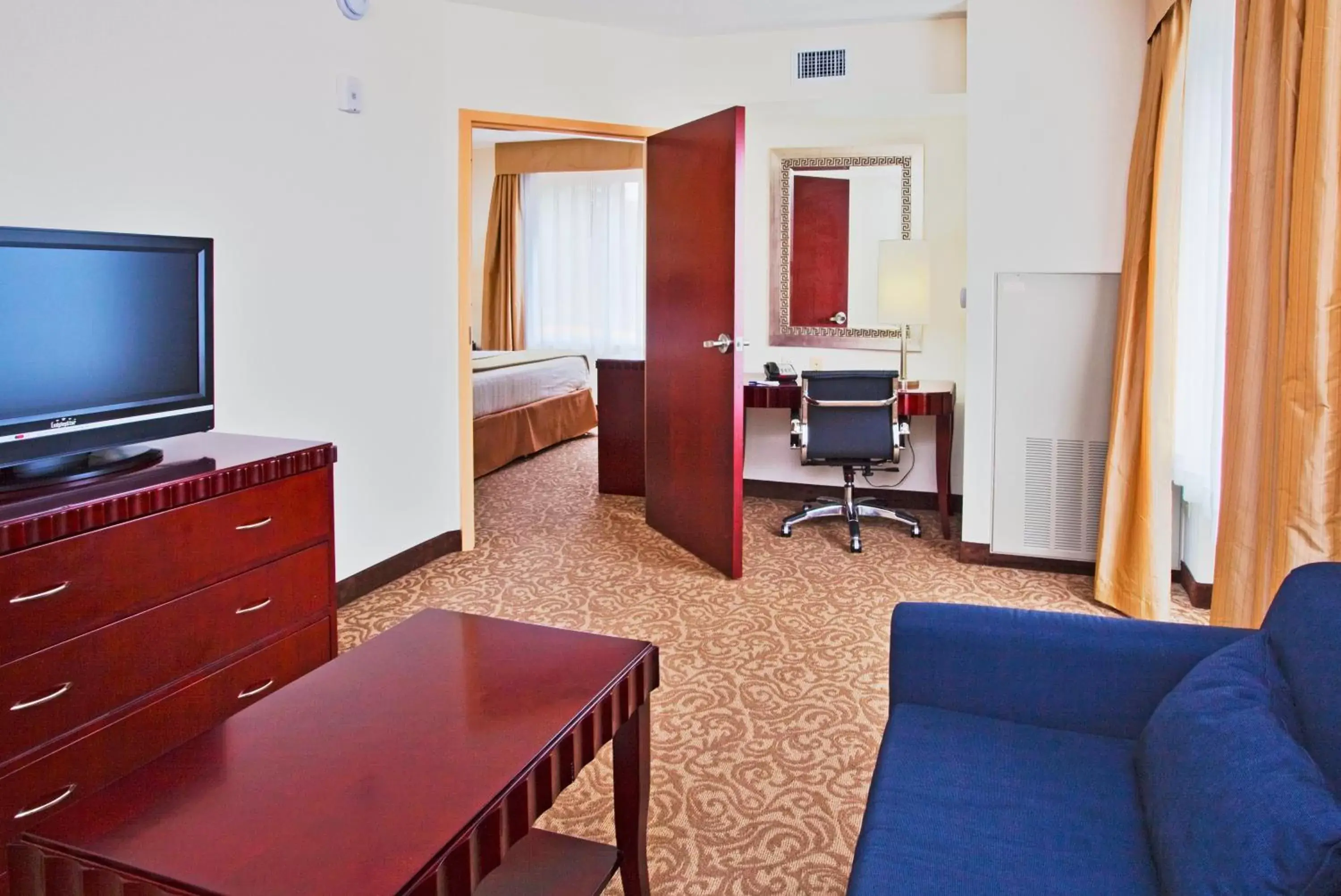 Photo of the whole room, TV/Entertainment Center in Holiday Inn Express Hotel & Suites Brooksville-I-75, an IHG Hotel