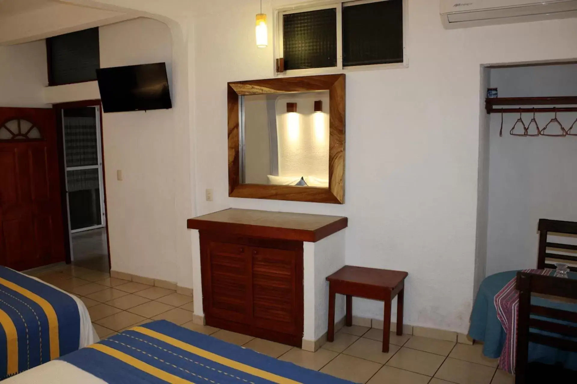 Bedroom, TV/Entertainment Center in Hotel Careyes Puerto Escondido