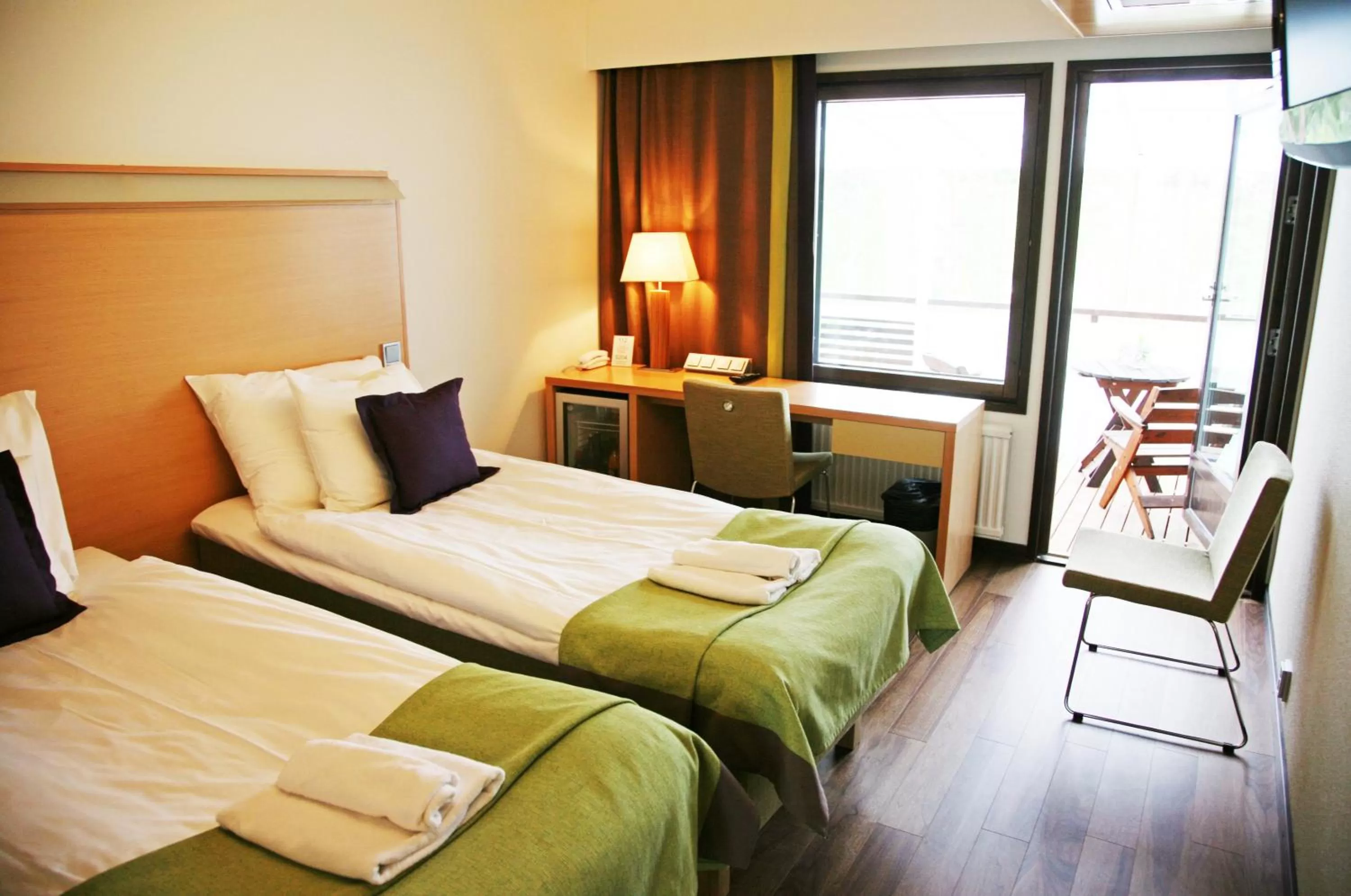 Photo of the whole room, Bed in Saimaanranta Resort by Anttolanhovi