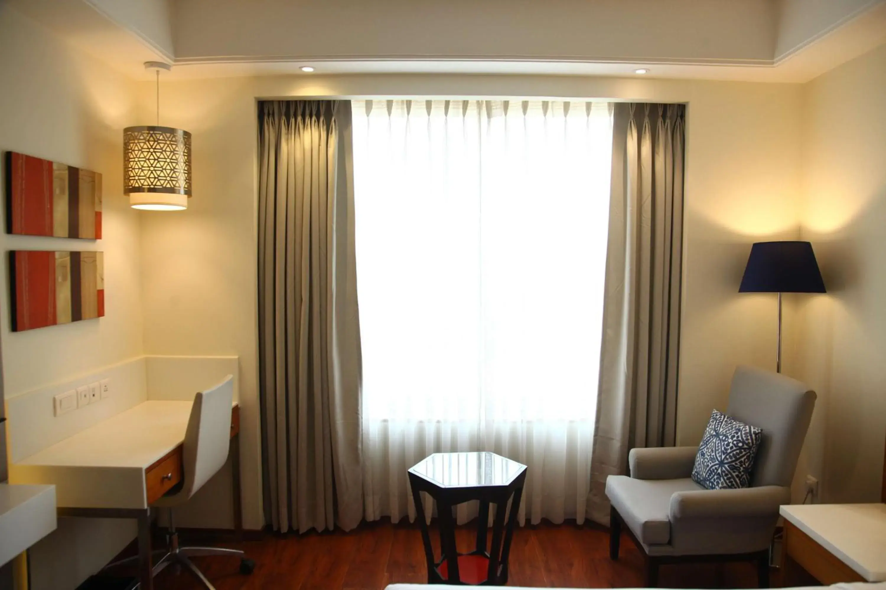Bedroom, Seating Area in The Place Gurugram, a member of Radisson Individuals