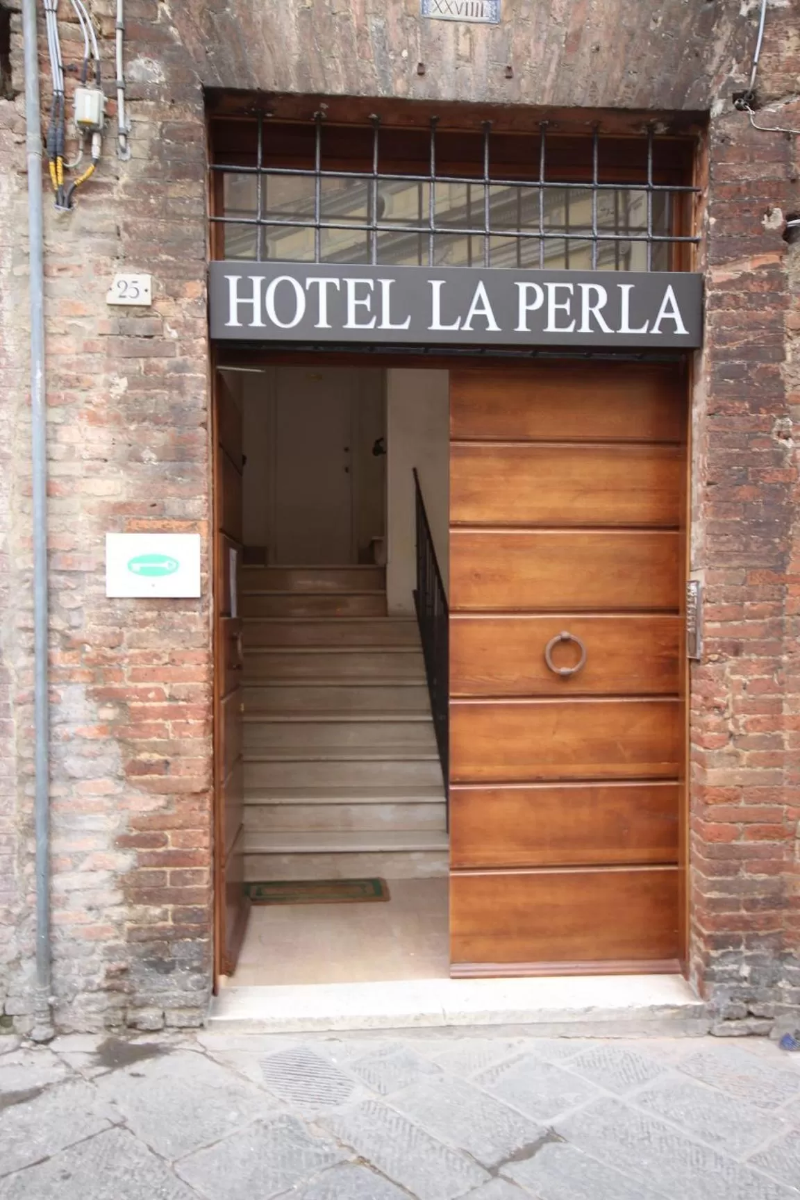 Facade/entrance in Hotel La Perla