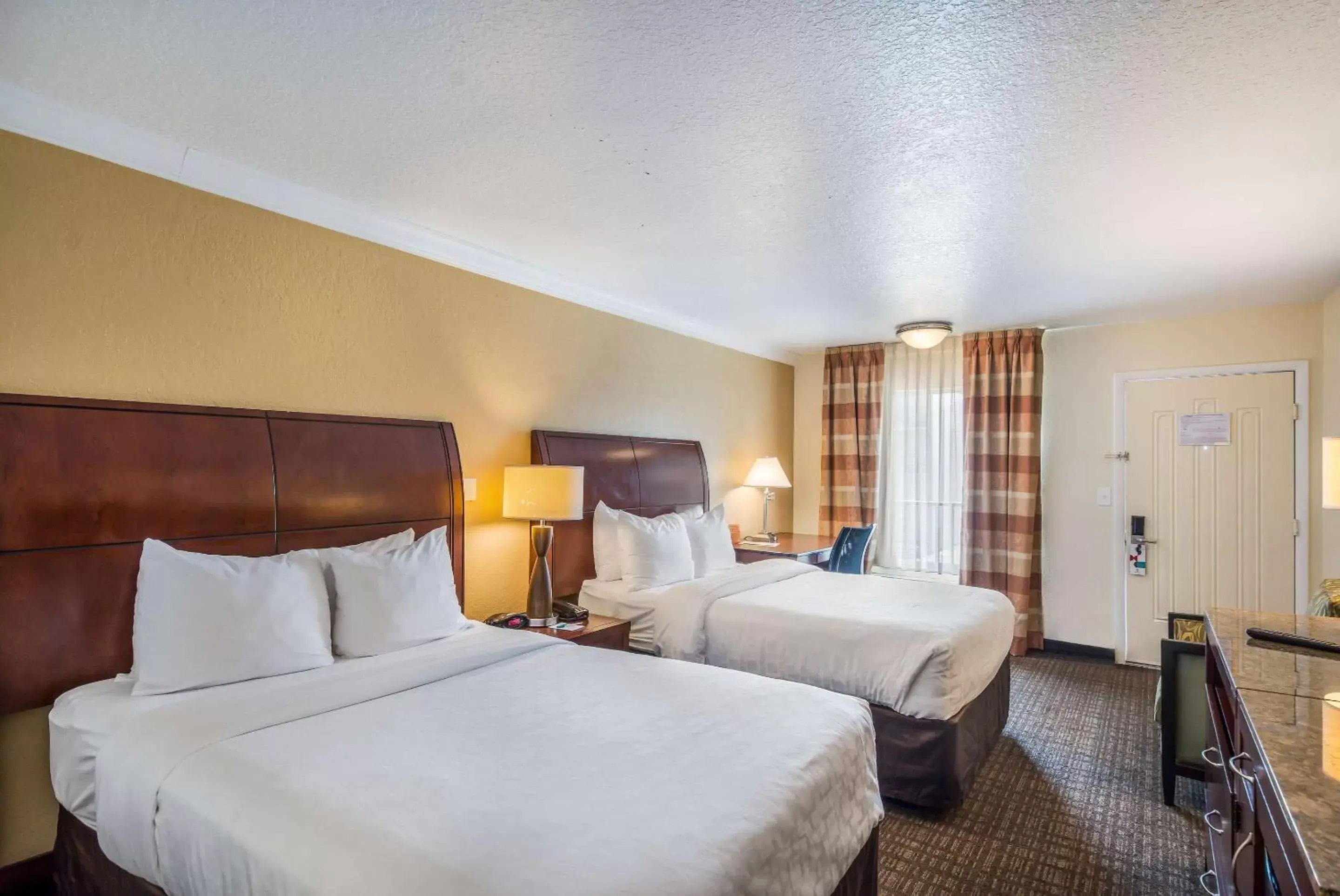 Photo of the whole room, Bed in Clarion Inn & Suites Central Clearwater Beach