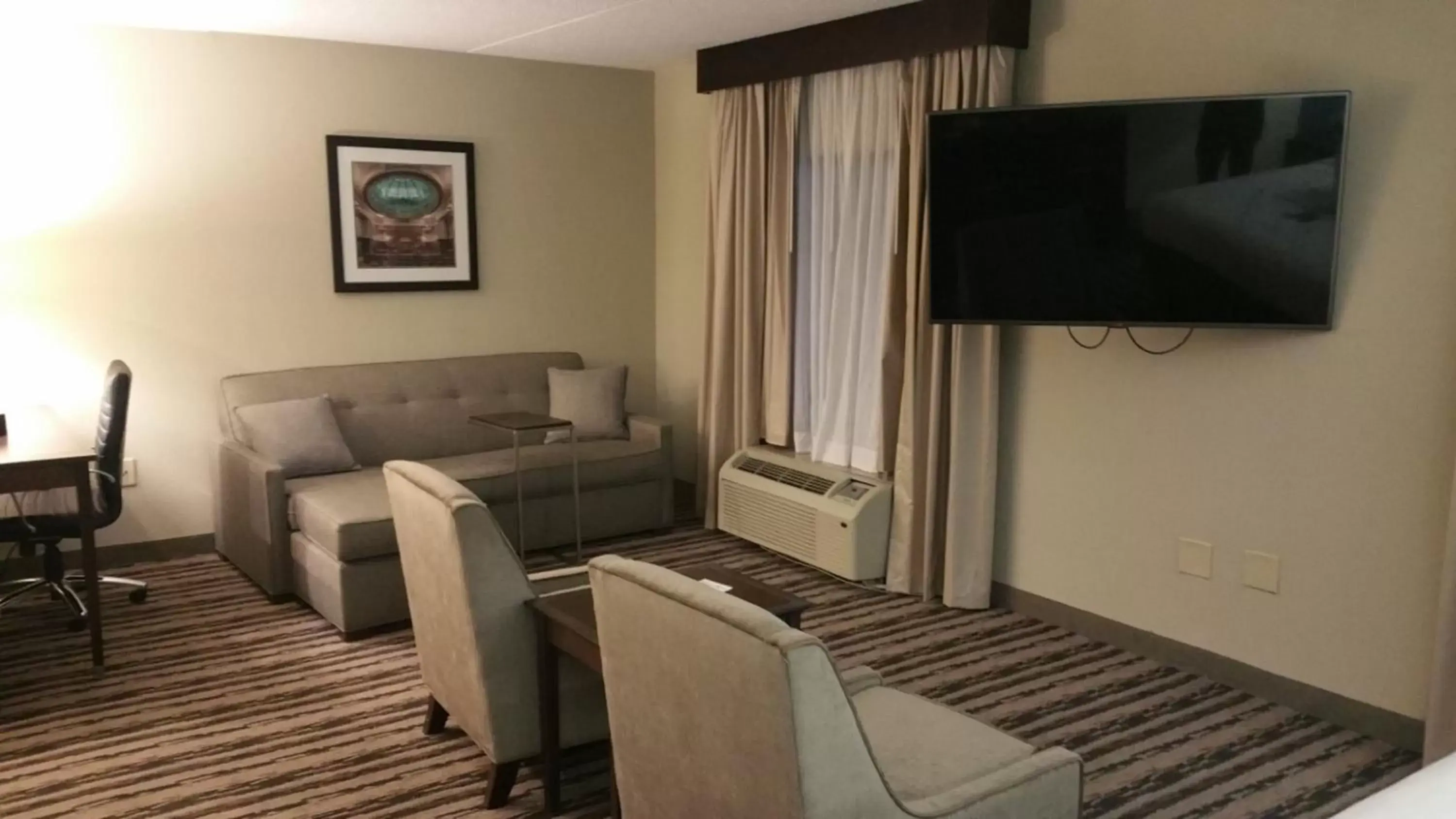 Guests, TV/Entertainment Center in Holiday Inn Harrisburg East, an IHG Hotel