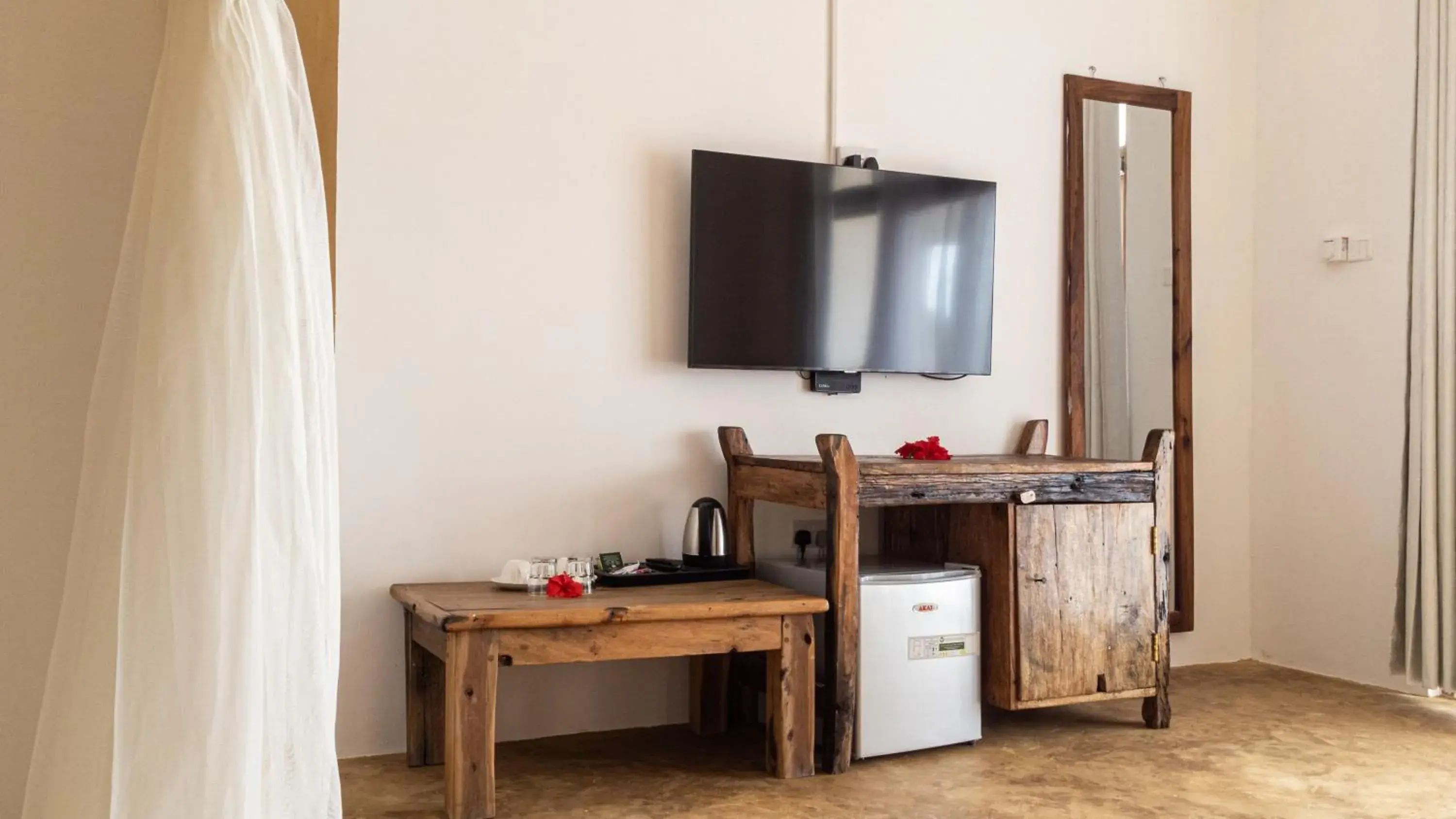 Bedroom, TV/Entertainment Center in Nungwi Garden Boutique Hotel