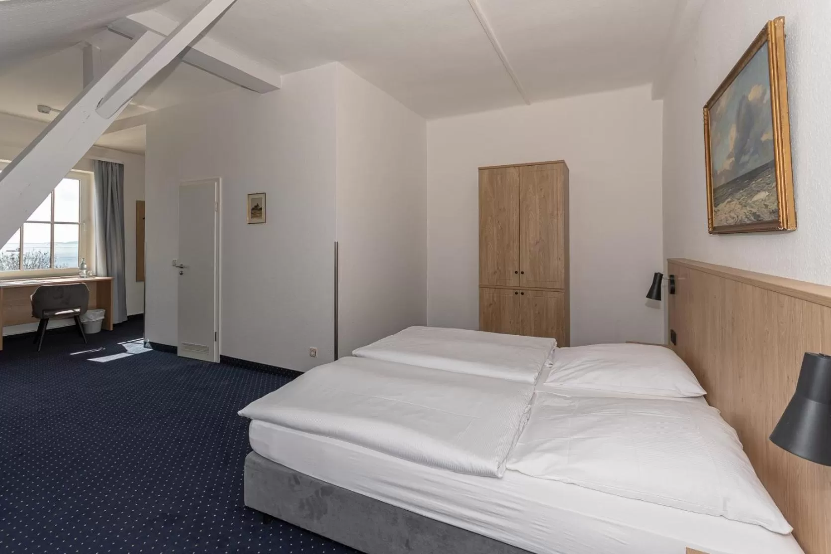 Photo of the whole room, Bed in Kurhotel Sassnitz