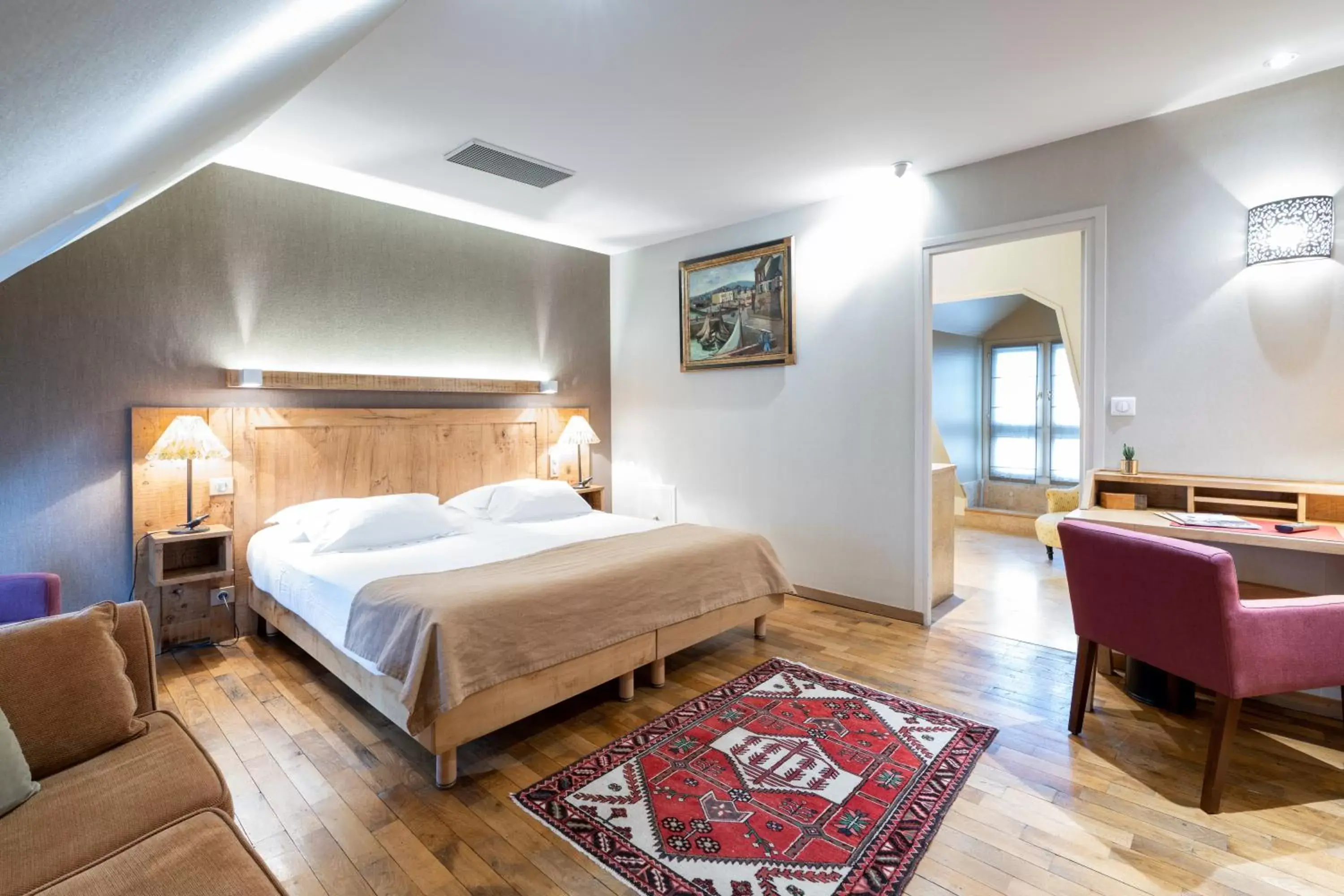 Bed in L'Absinthe Hotel
