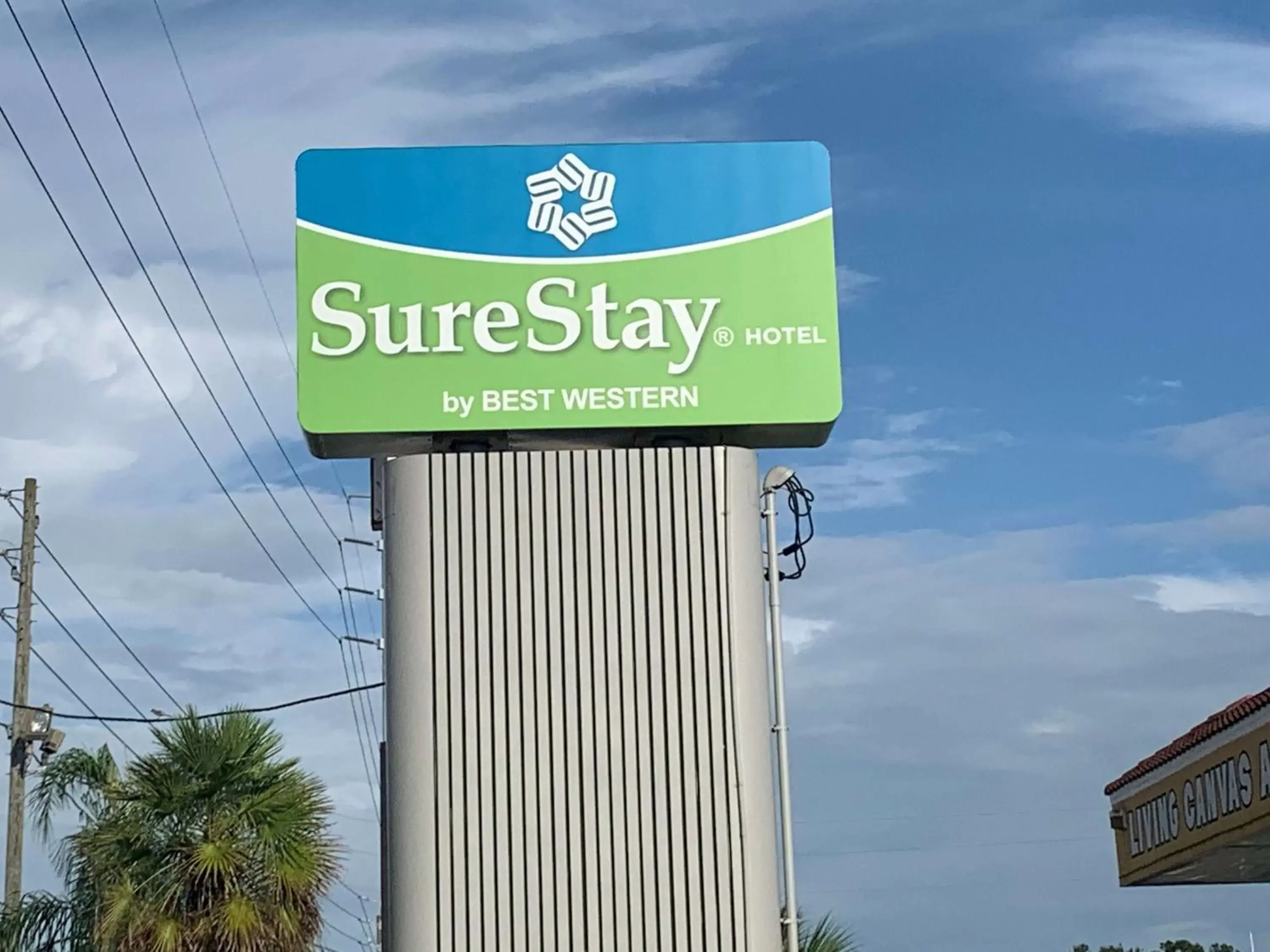 Property building, Property Logo/Sign in SureStay Hotel by Best Western Clermont Theme Park West