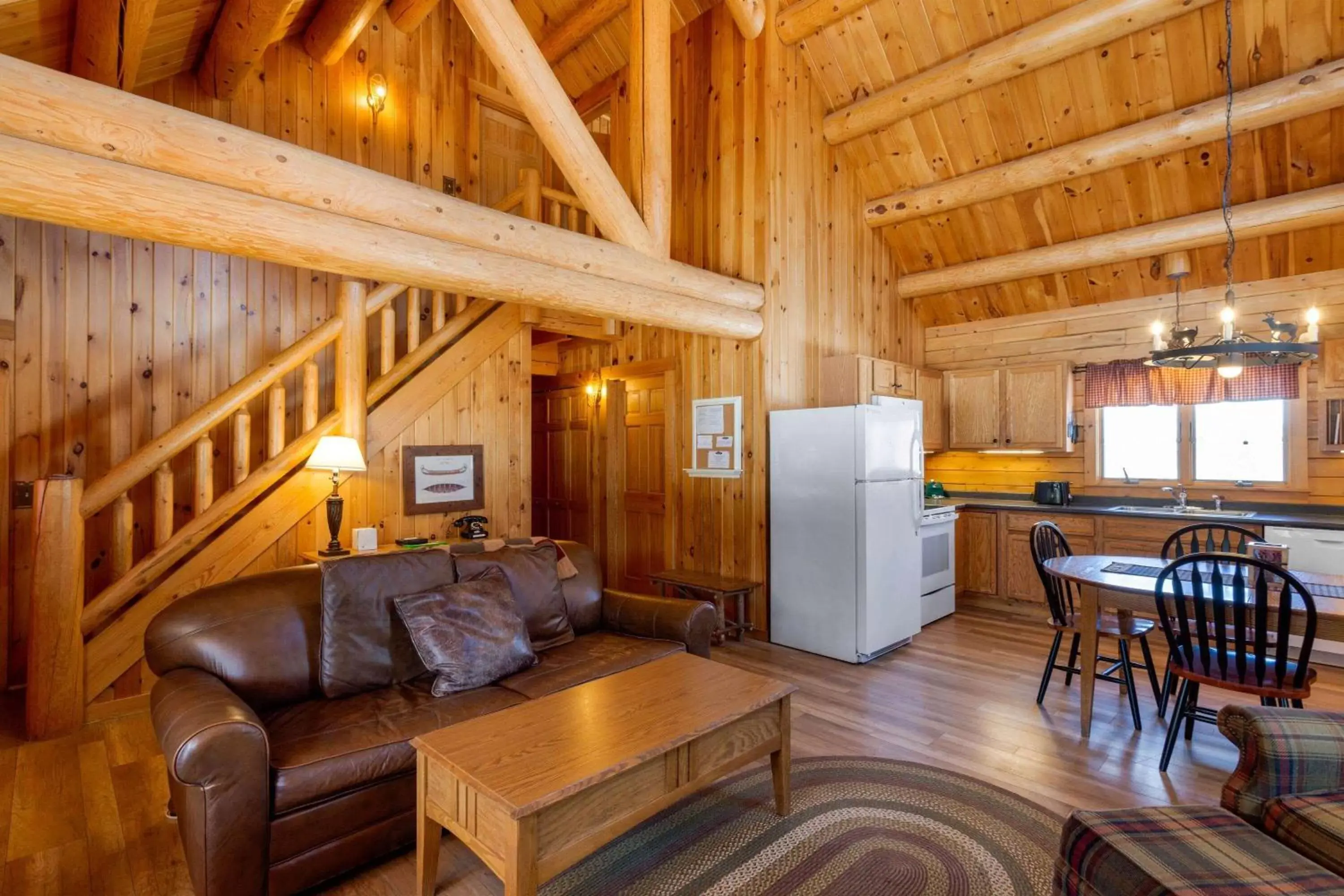 Bed, Seating Area in Rangeley Lake Resort a Ramada by Wyndham