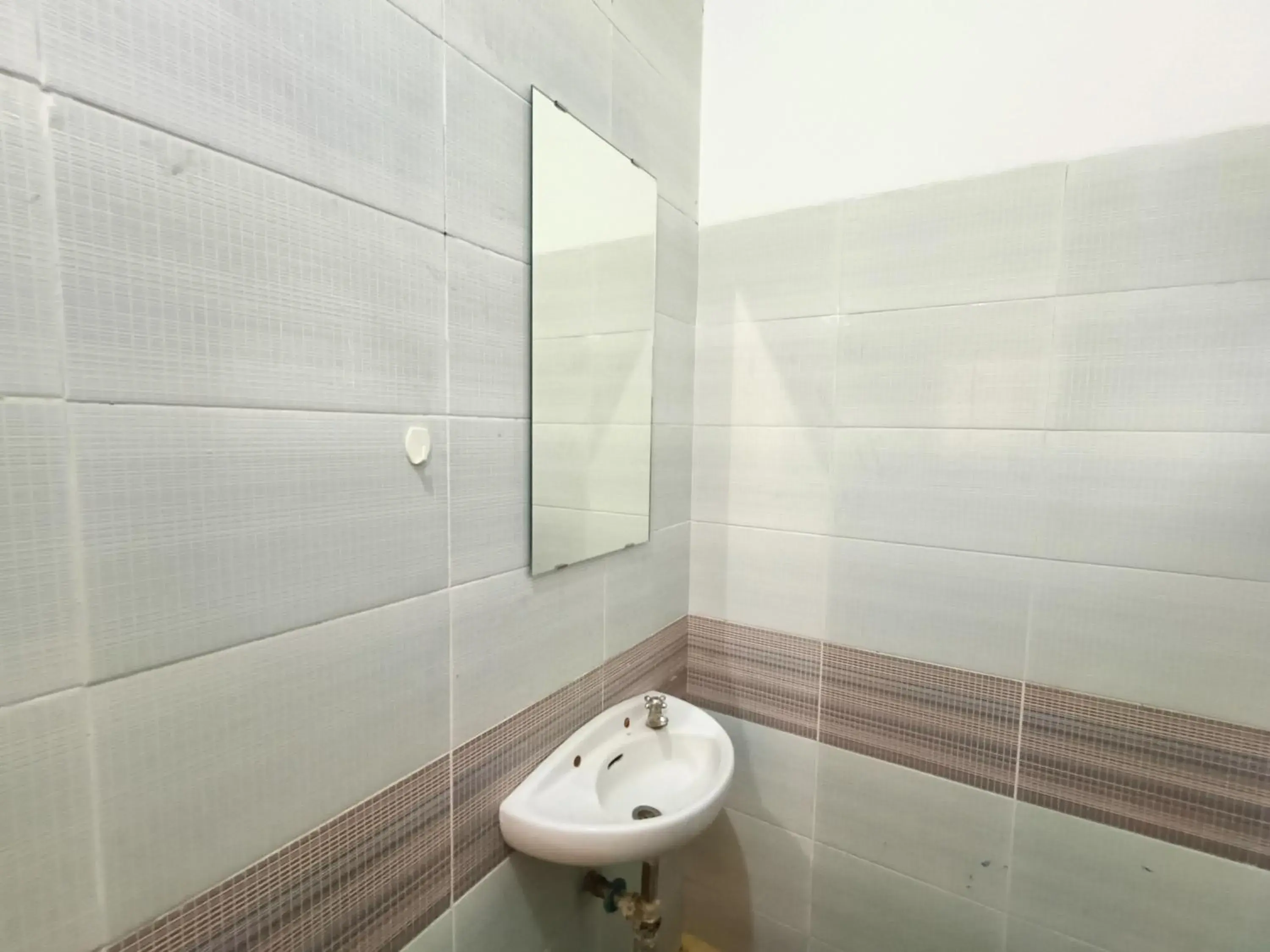 Bathroom in OYO 90260 Bumi Merpati Residence