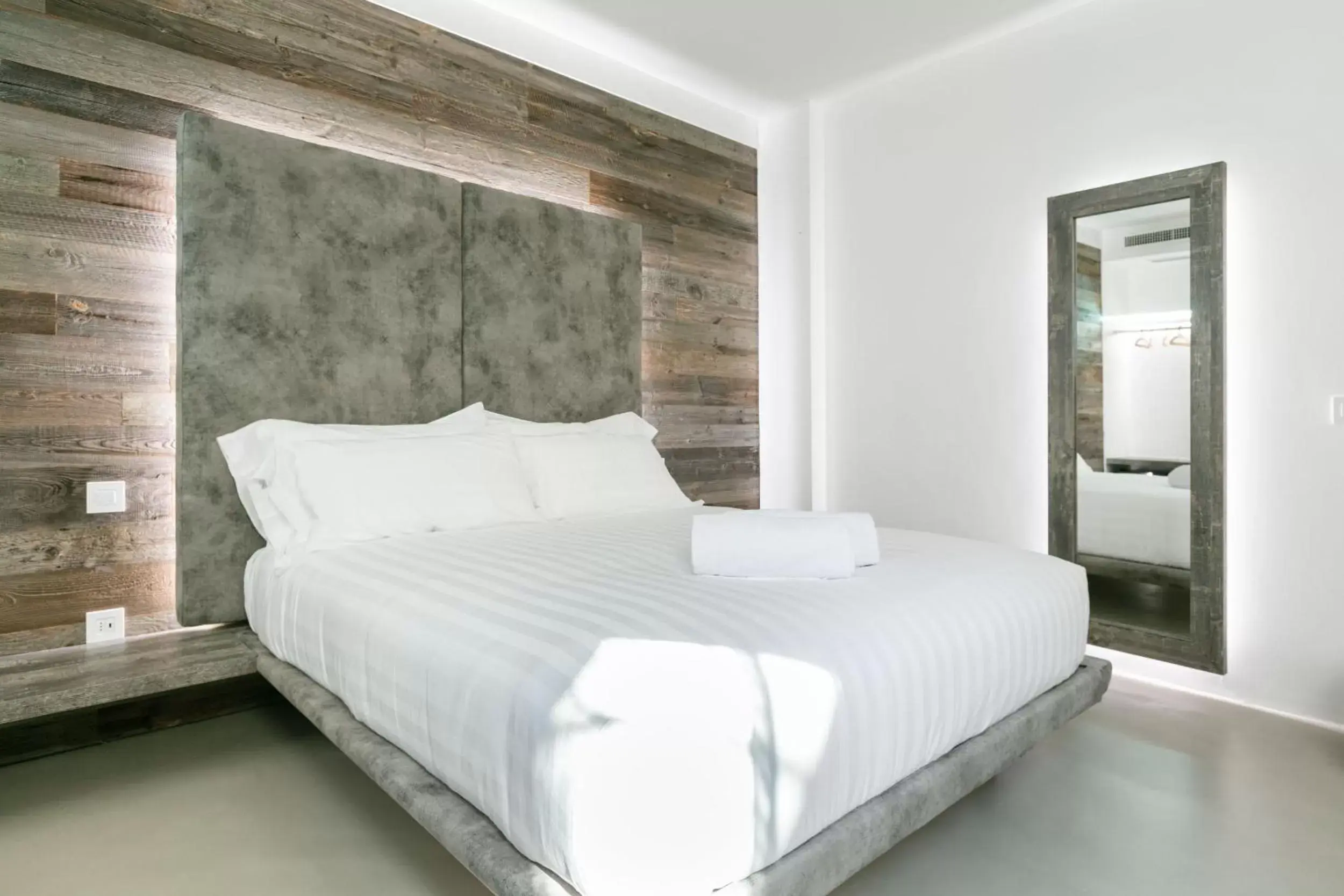 Bed in DOMUS CAVOUR Rooms&Suites