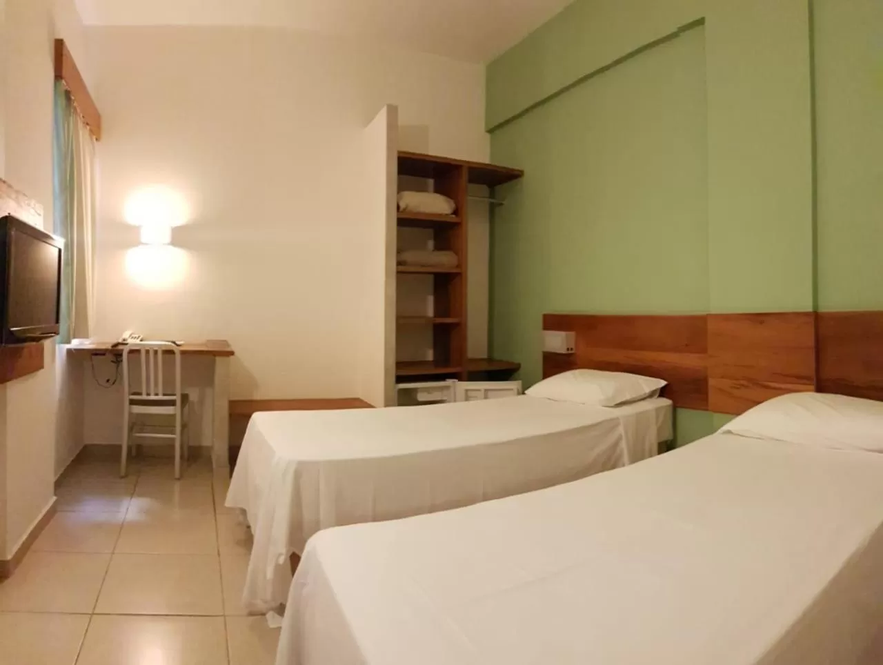 Bed in Meu Hotel Garça