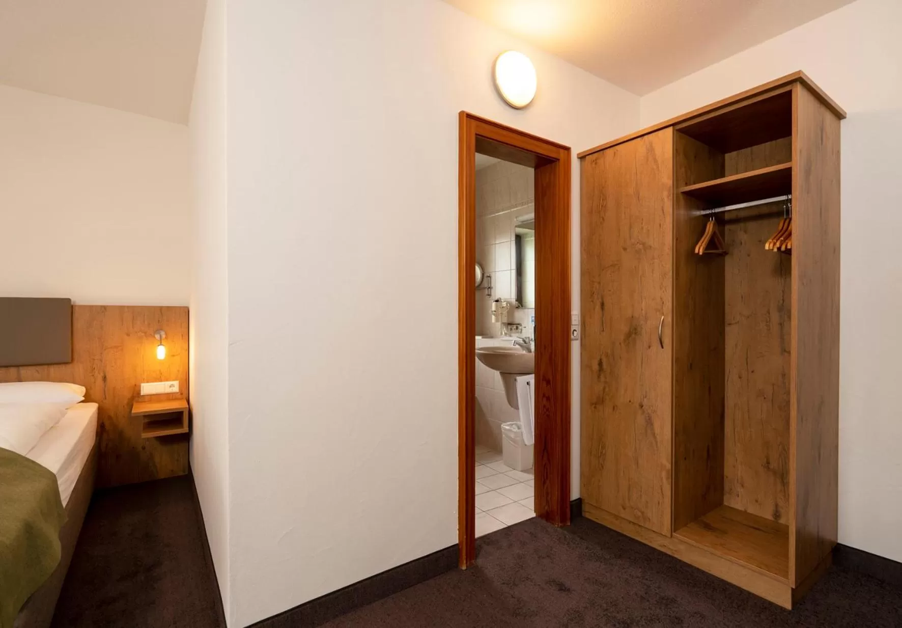 wardrobe, Bed in Hotel Krone