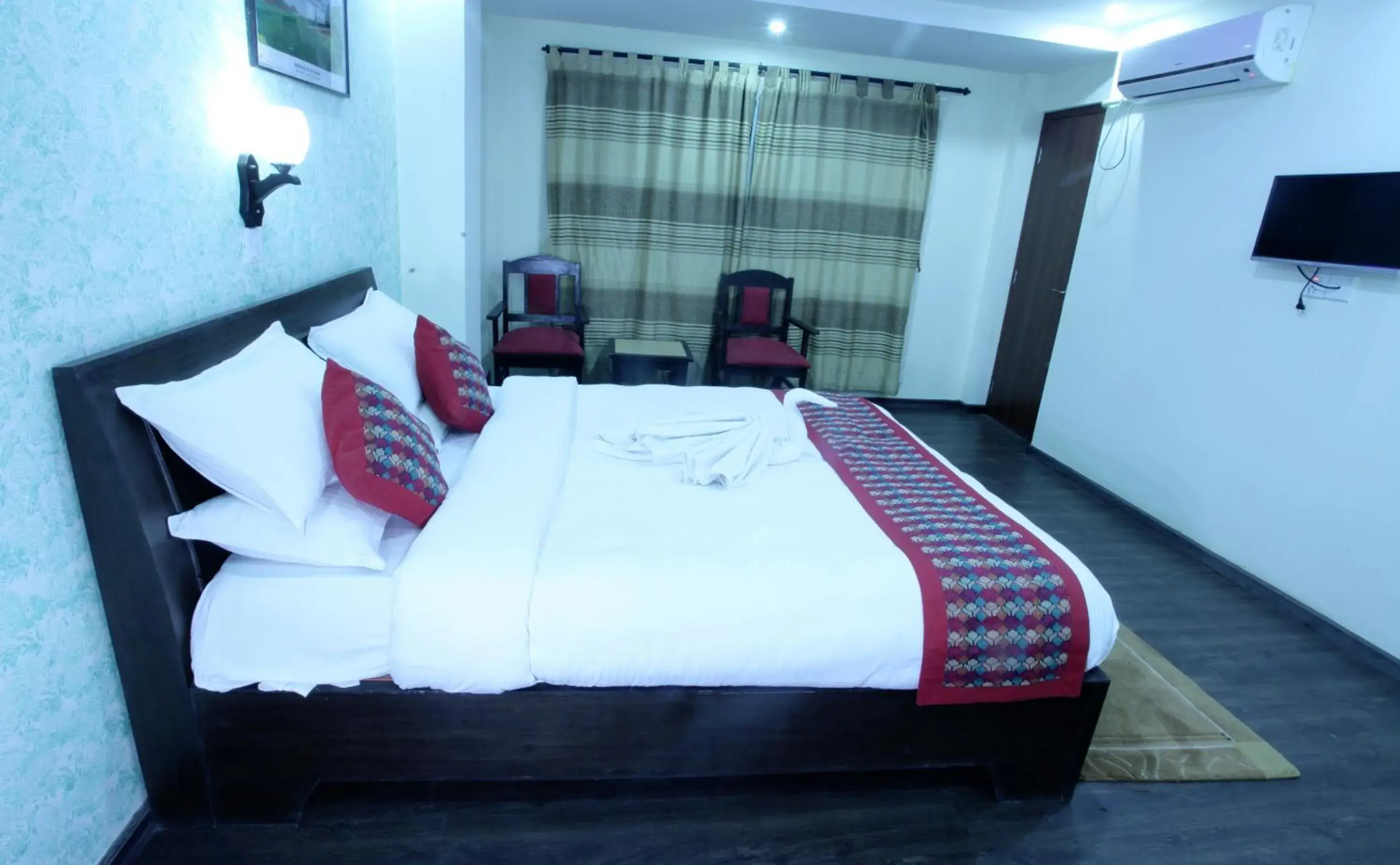 Bed in Alpine Hotel & Apartment