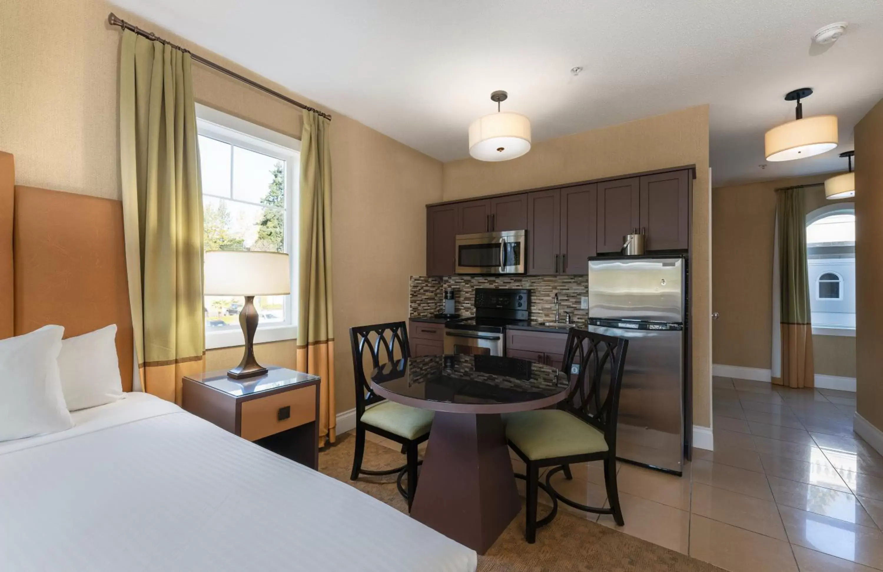 Bed, Dining Area in Prestige Oceanfront Resort, WorldHotels Luxury