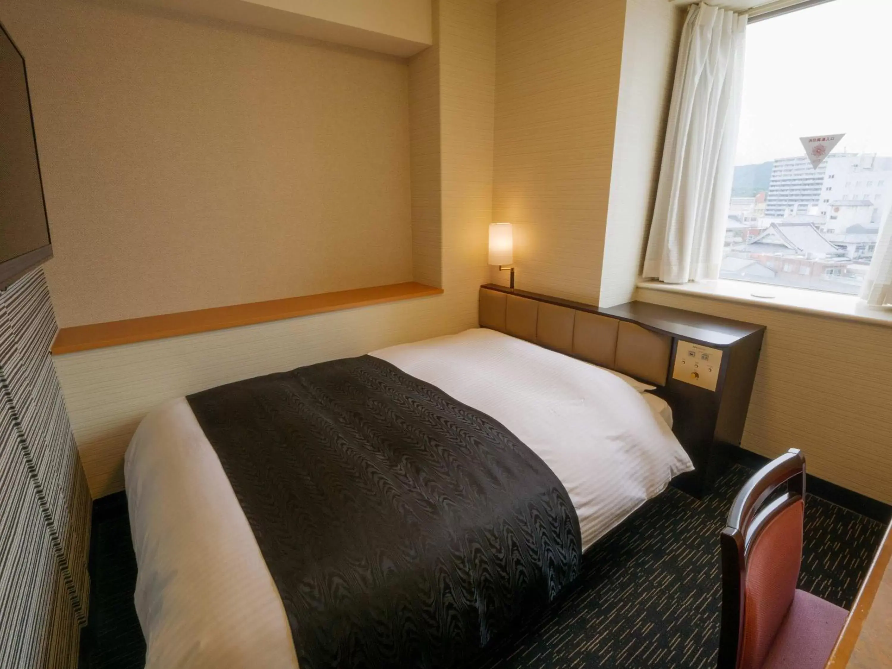 Photo of the whole room, Bed in APA Hotel Miyazaki Nobeoka Eki Minami