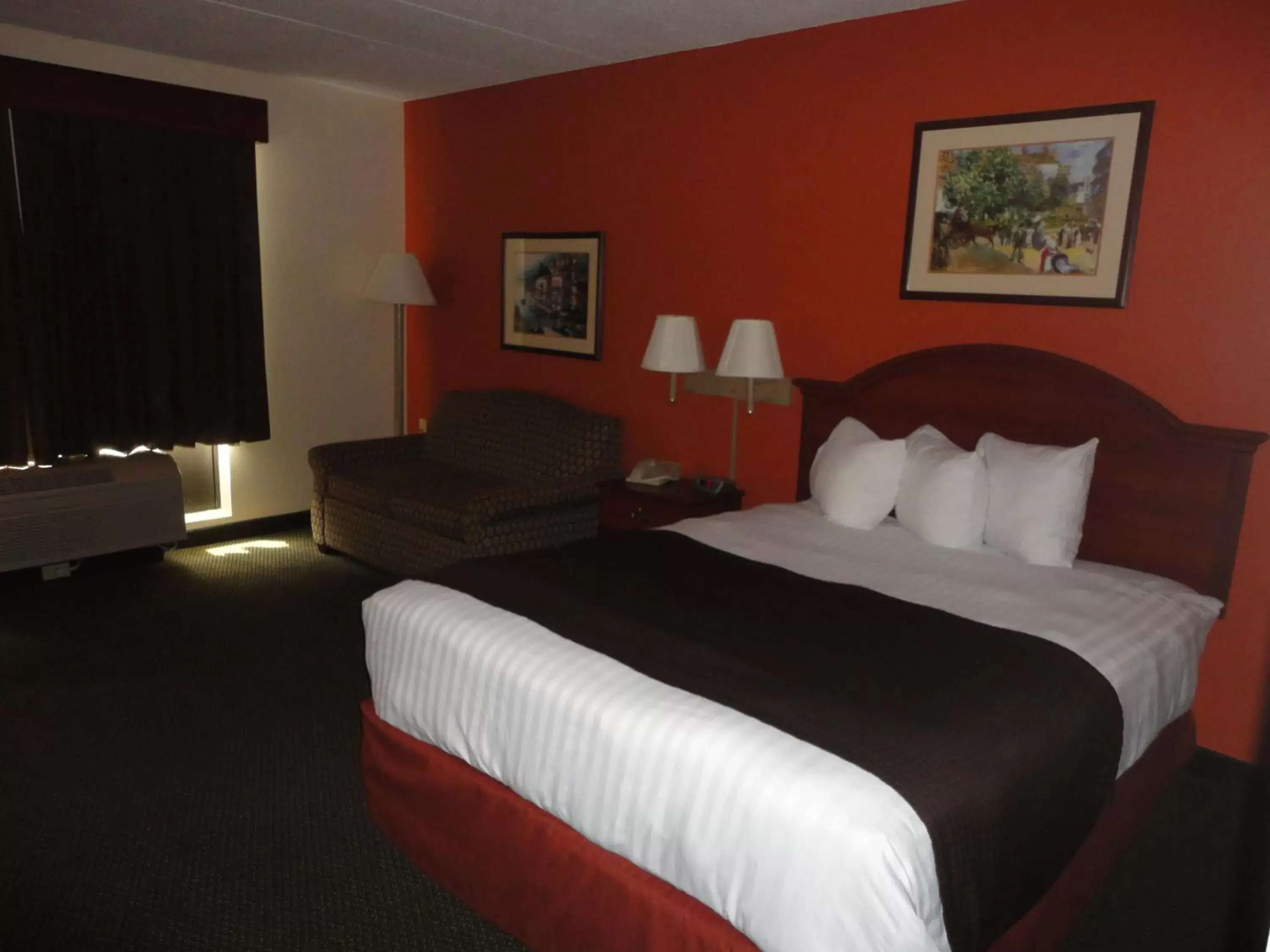 Bed in AmericInn by Wyndham Ottumwa