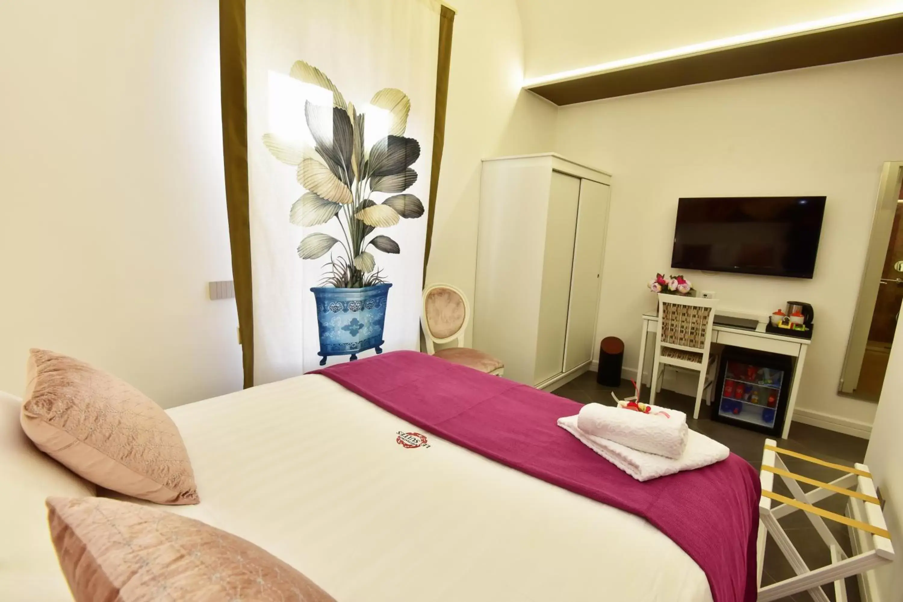 Bed in ANFITEATRO LE SUITES