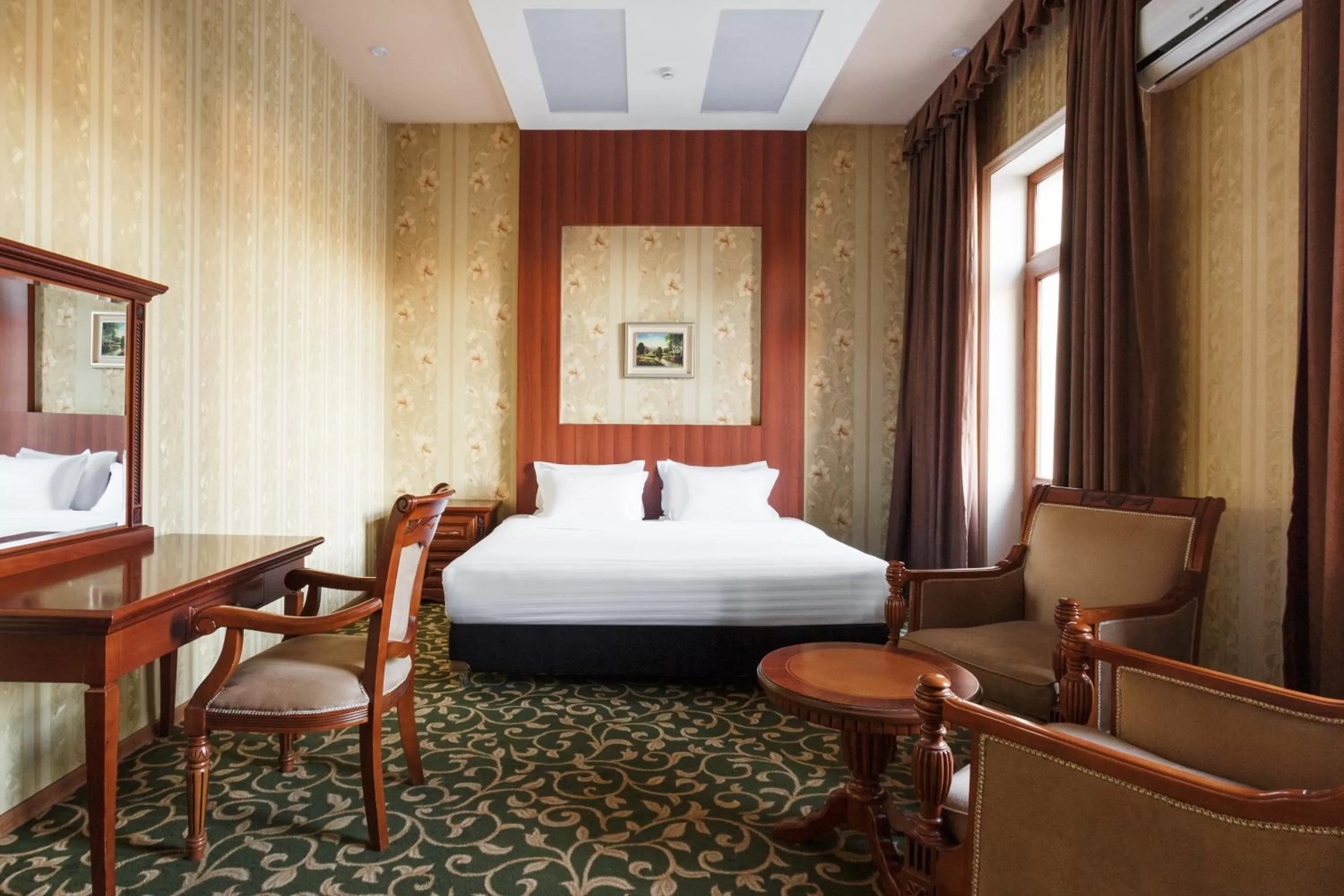 Bed in Western Suites Hotel