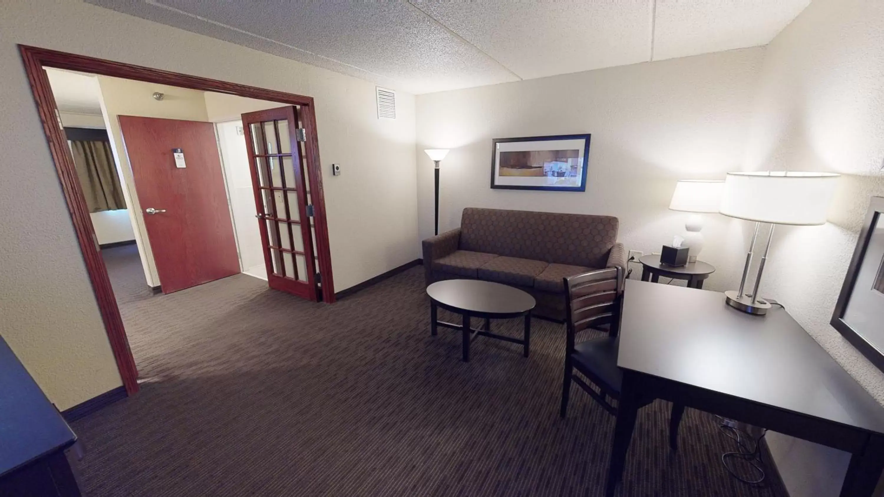 Living room, Seating Area in AmericInn by Wyndham Mounds View Minneapolis