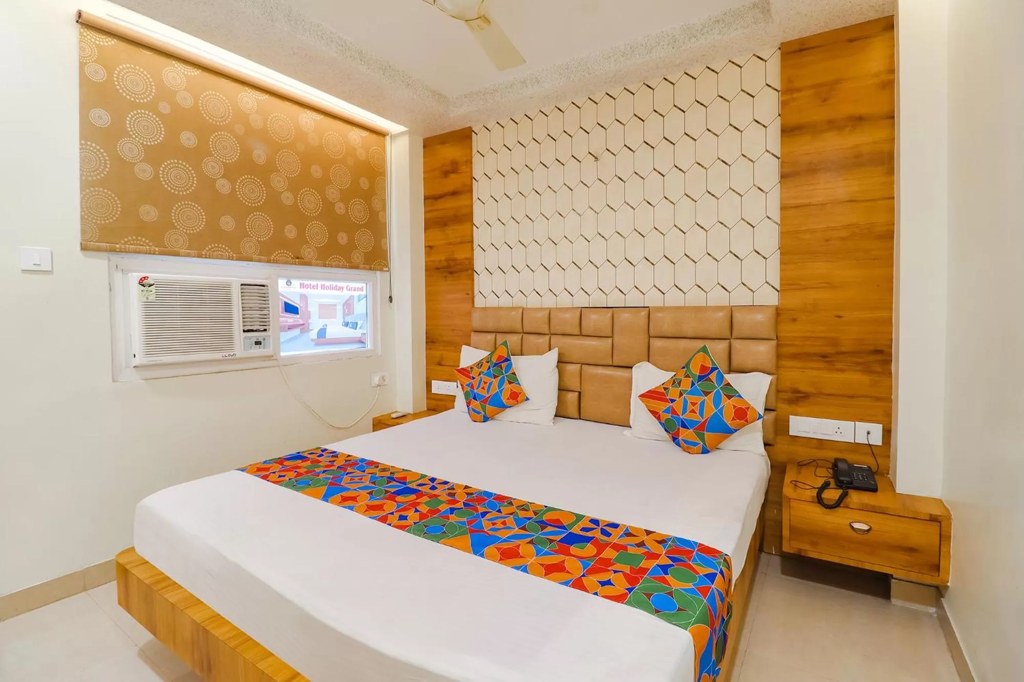 Bed in FabHotel Holiday Grand