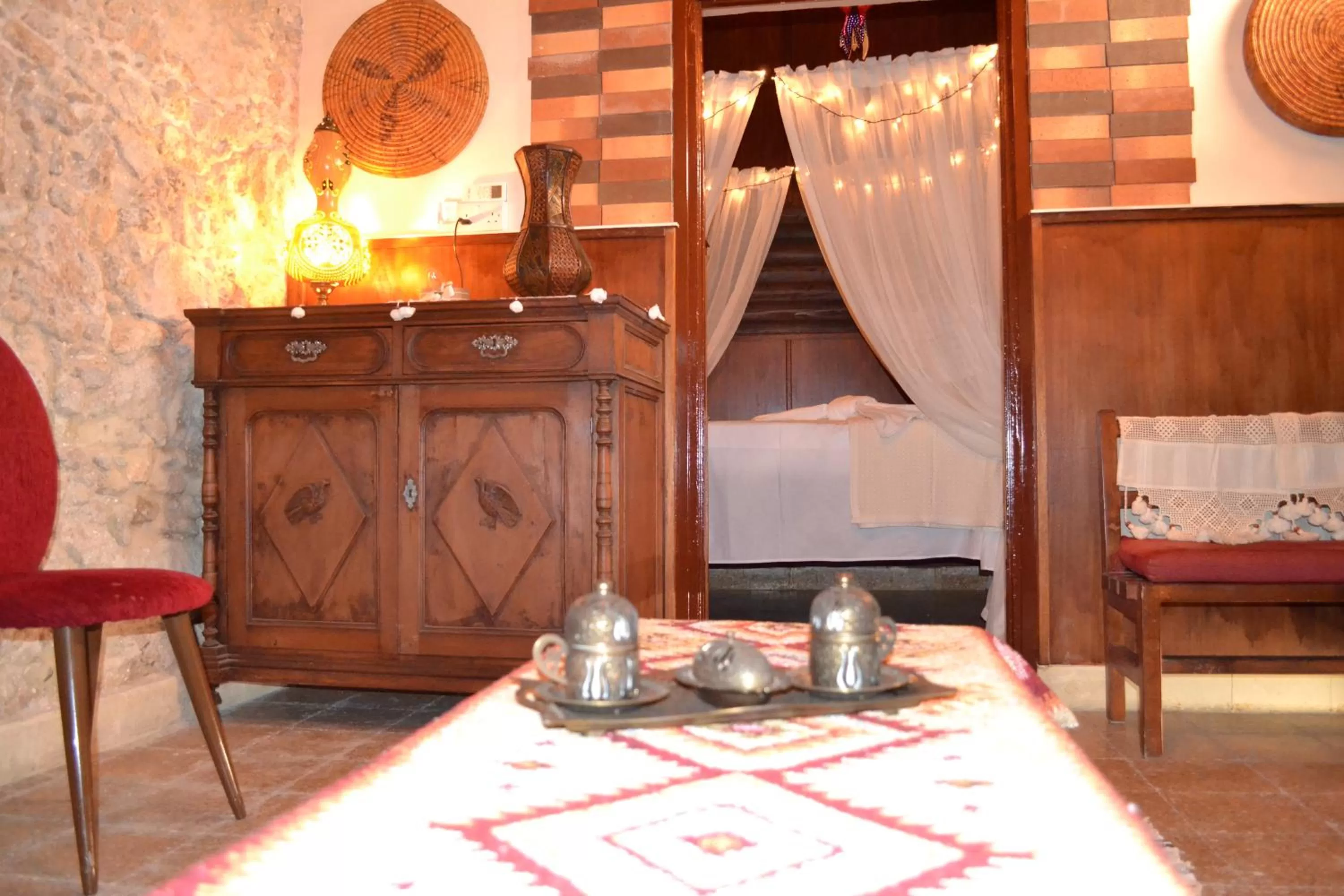 Seating area, Bed in Mystery Garden Guest House