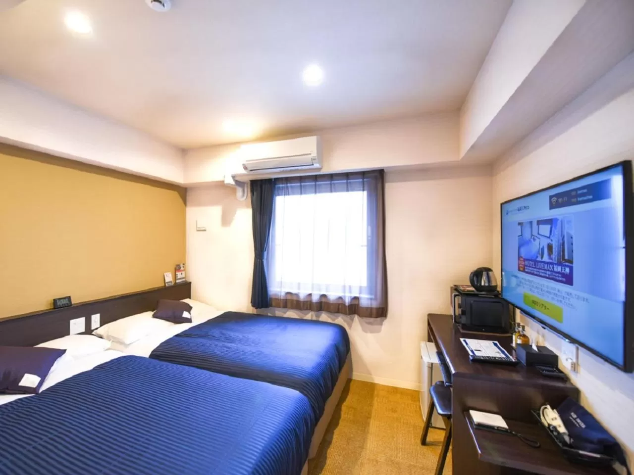 Photo of the whole room, Bed in HOTEL LiVEMAX Fukuoka Tenjin