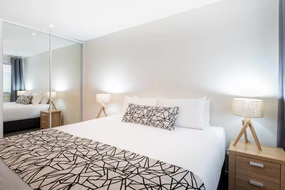 Bed in Warners Bay Apartments