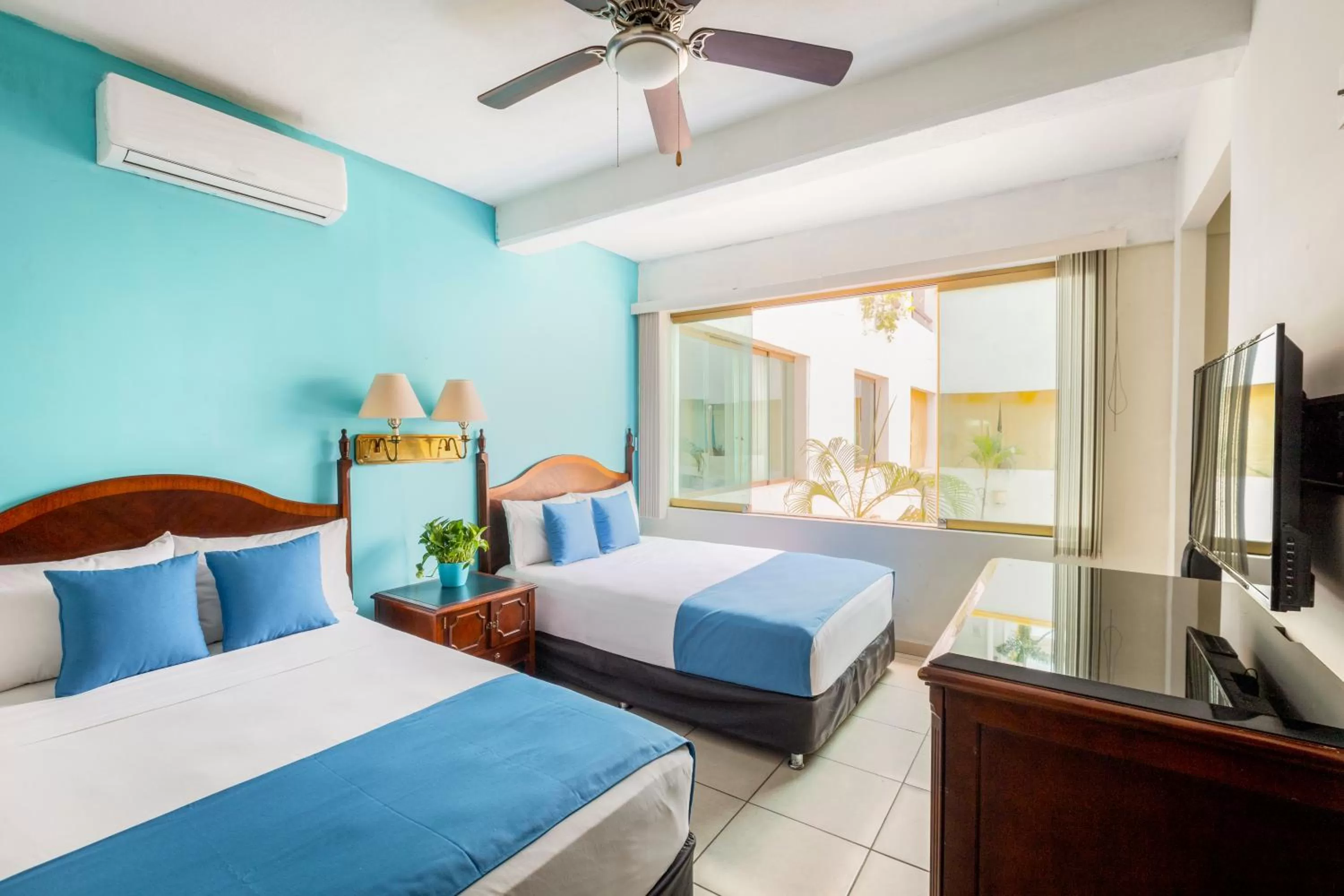 Bed in Hotel Pueblito Vallarta