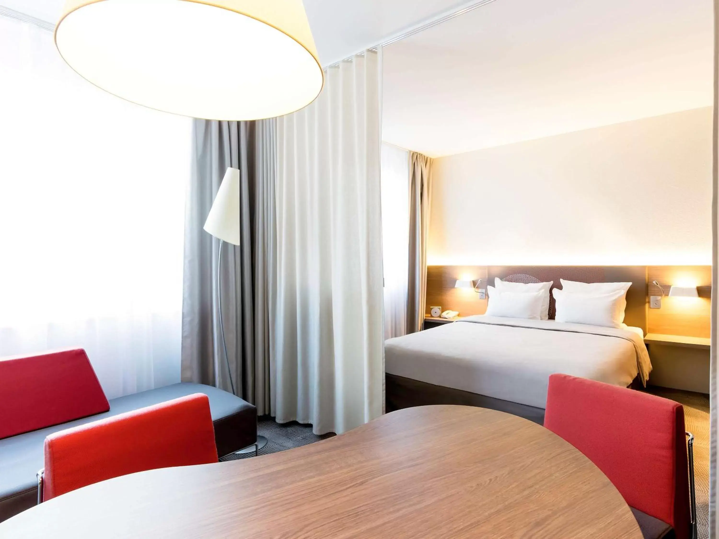 Photo of the whole room, Bed in Novotel Suites Genève Aéroport