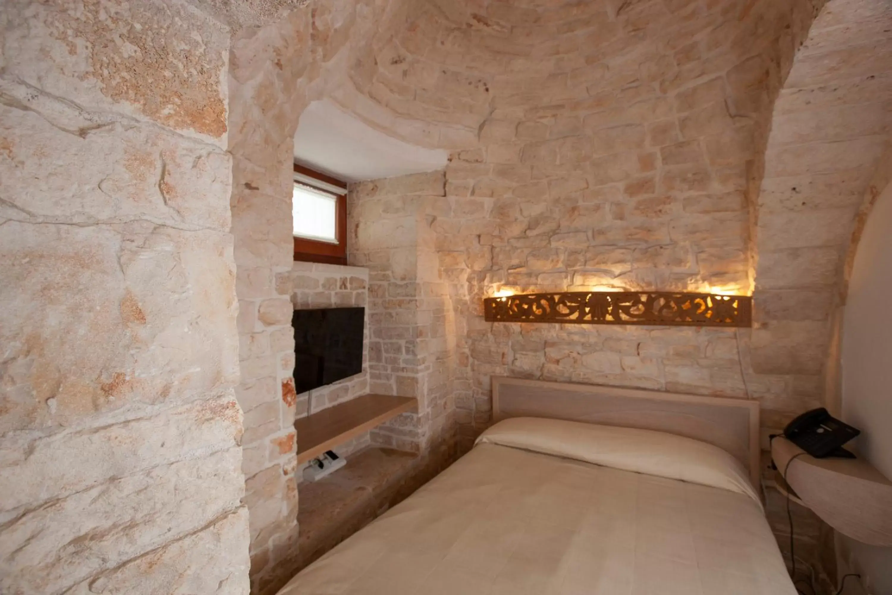 Bed in Le Alcove-Luxury Hotel nei Trulli