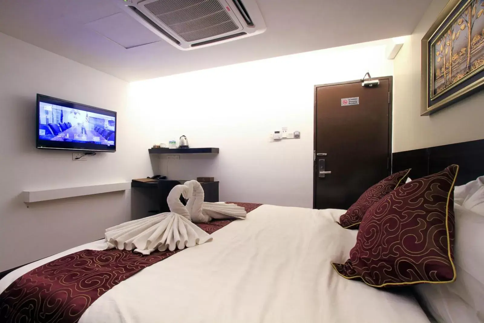 Bed in J Suites Hotel